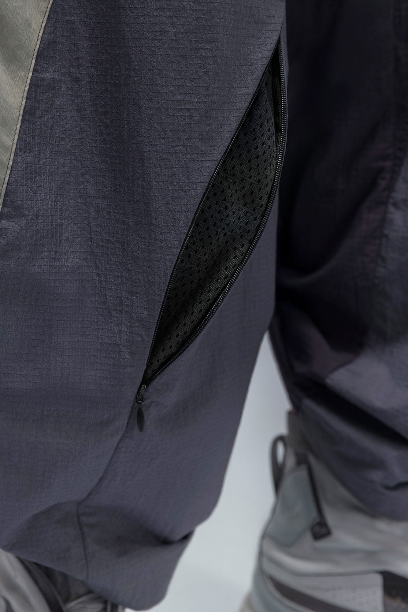 XIPHEVIL Deconstructed Contrast Panel Utility Curved Pants, premium urban and streetwear designers apparel on PROJECTISR.com, XIPHEVIL