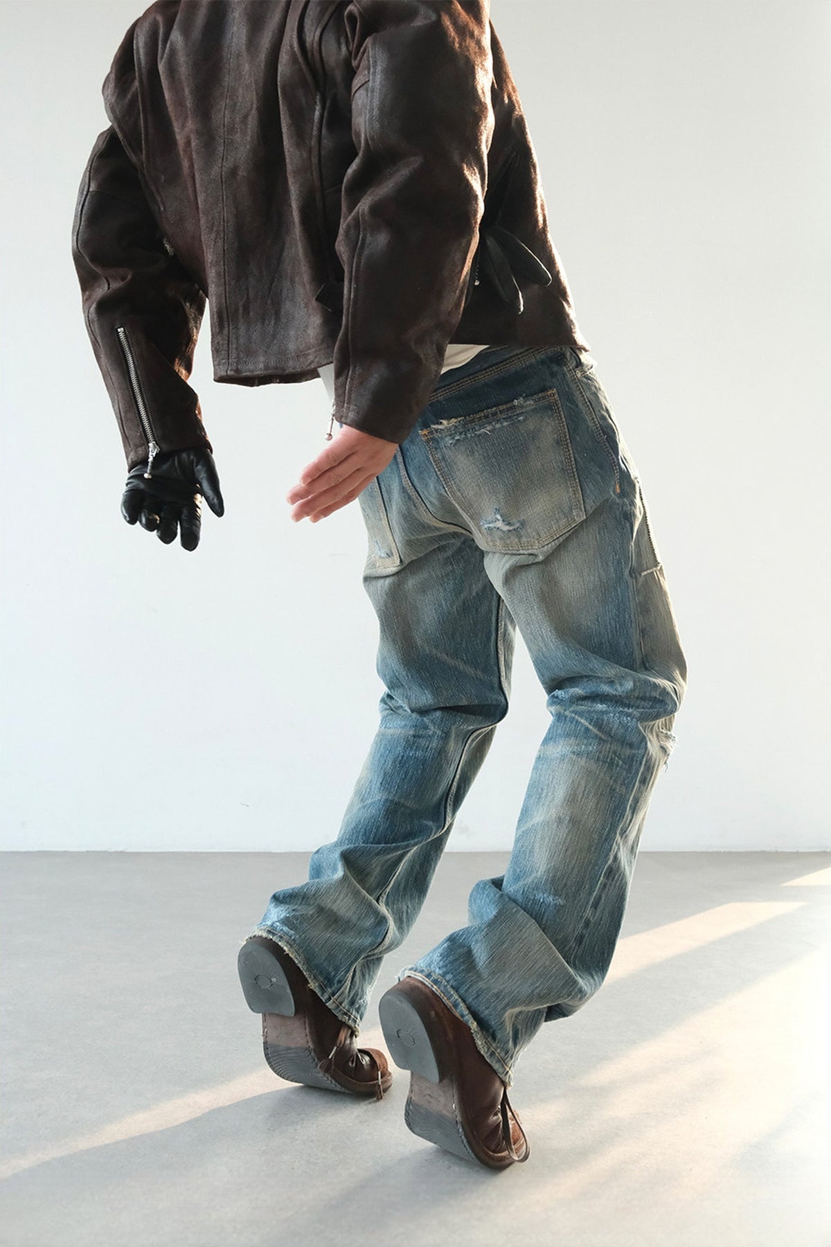 NEIGBORL Distressed Raw-Edge Selvedge Jeans — half body