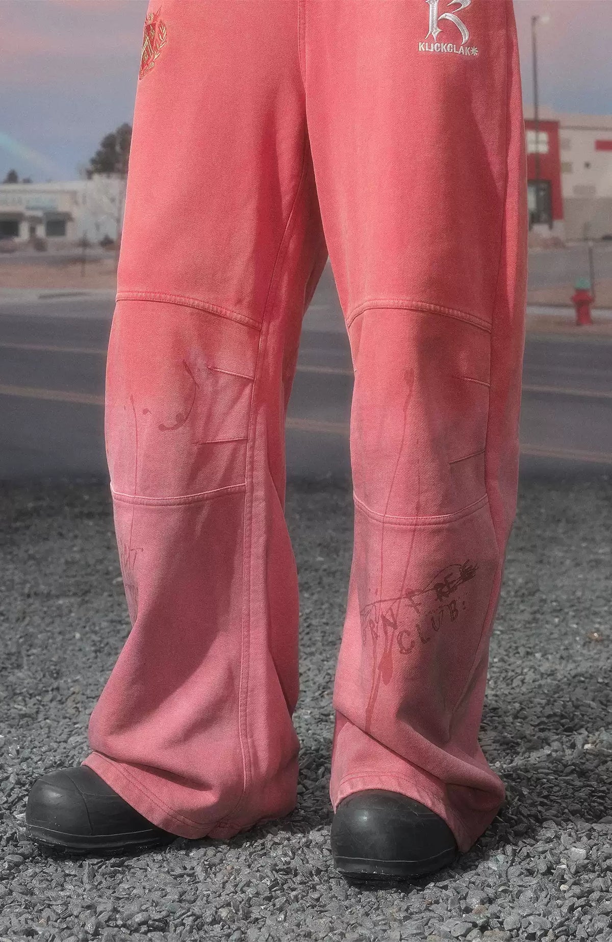 KLICK CLAK Paint-Splattered Graphic Curved Sweatpants