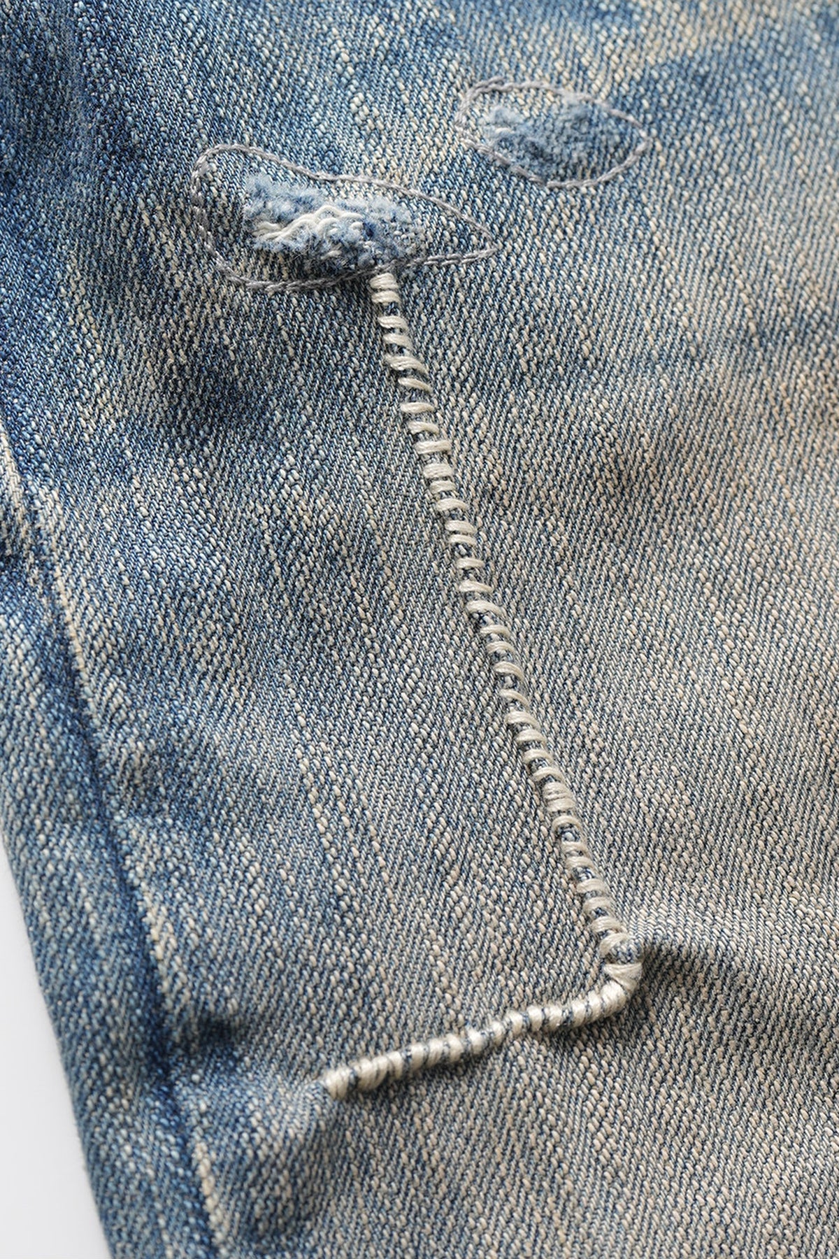 NEIGBORL Distressed Raw-Edge Selvedge Jeans — flat-lay detail