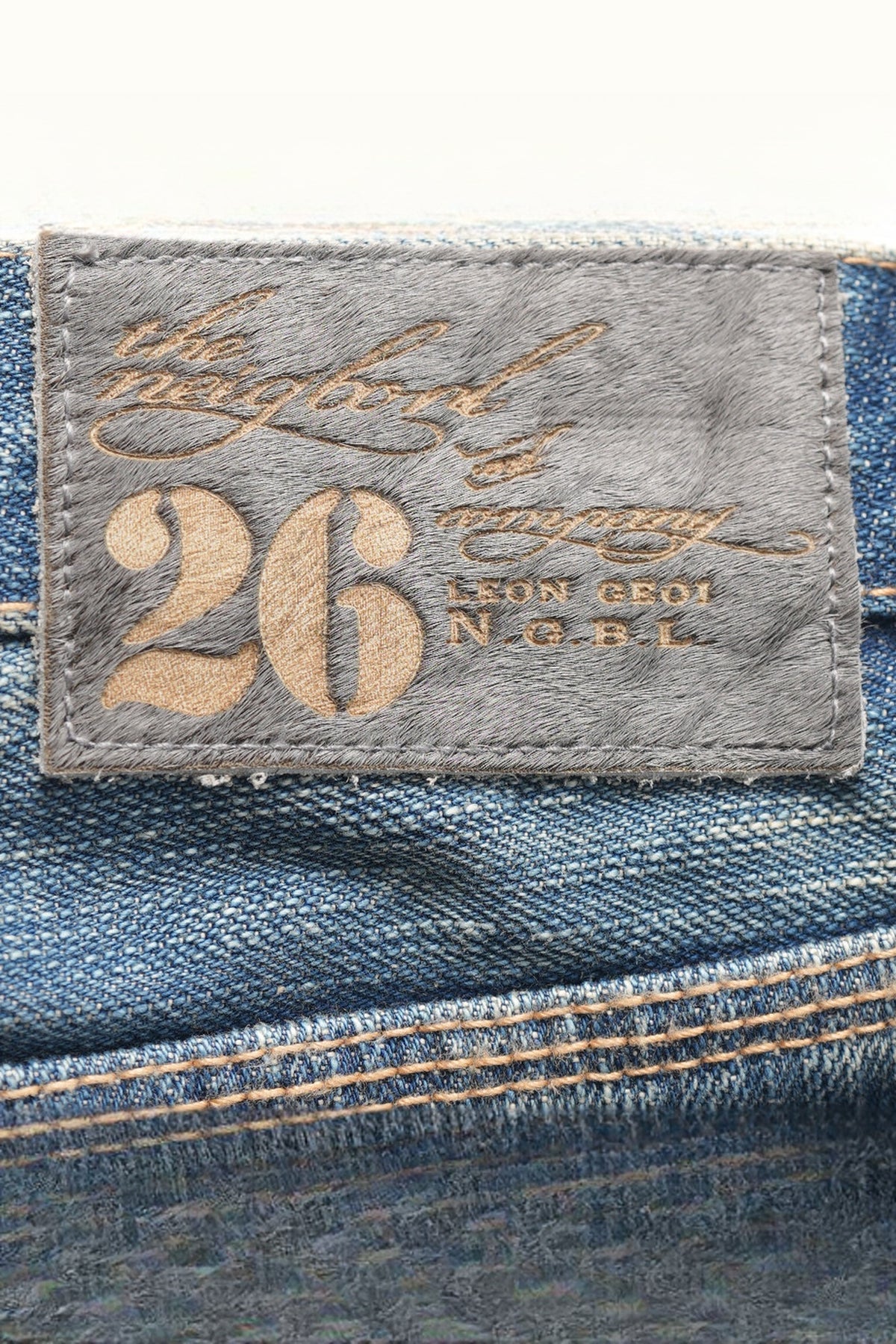 NEIGBORL Distressed Raw-Edge Selvedge Jeans — flat-lay detail