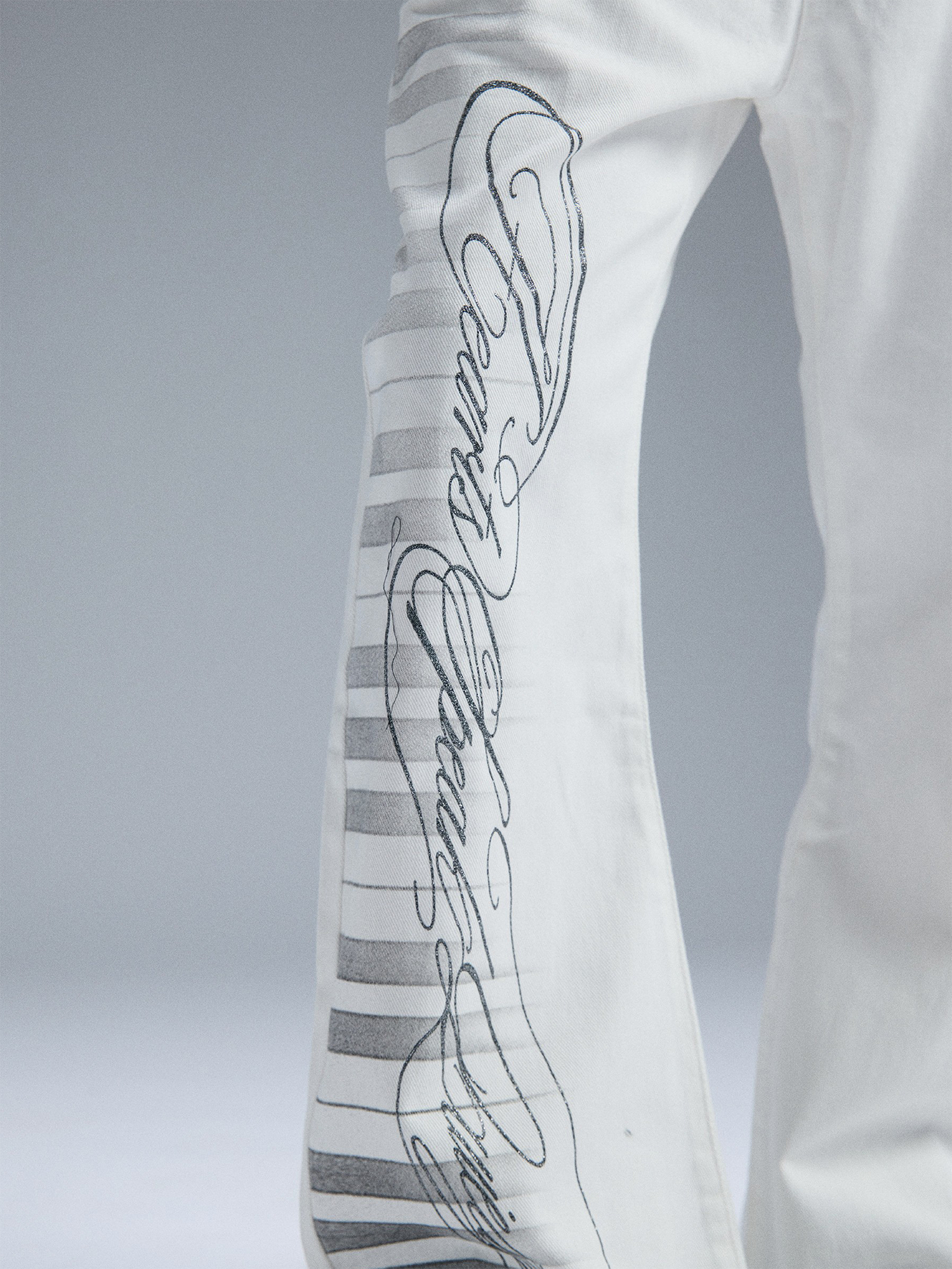 PAIKI Piano Key Script Foil Flared Jeans