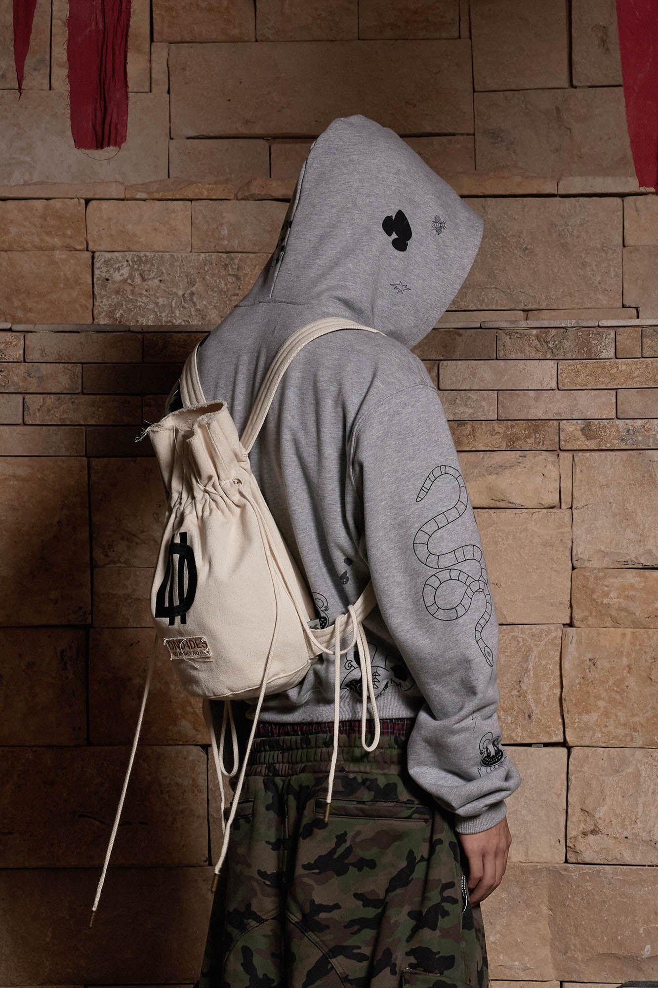 DND4DES LOGO Drawstring Bucket Backpack, premium urban and streetwear designers apparel on PROJECTISR.com, DND4DES