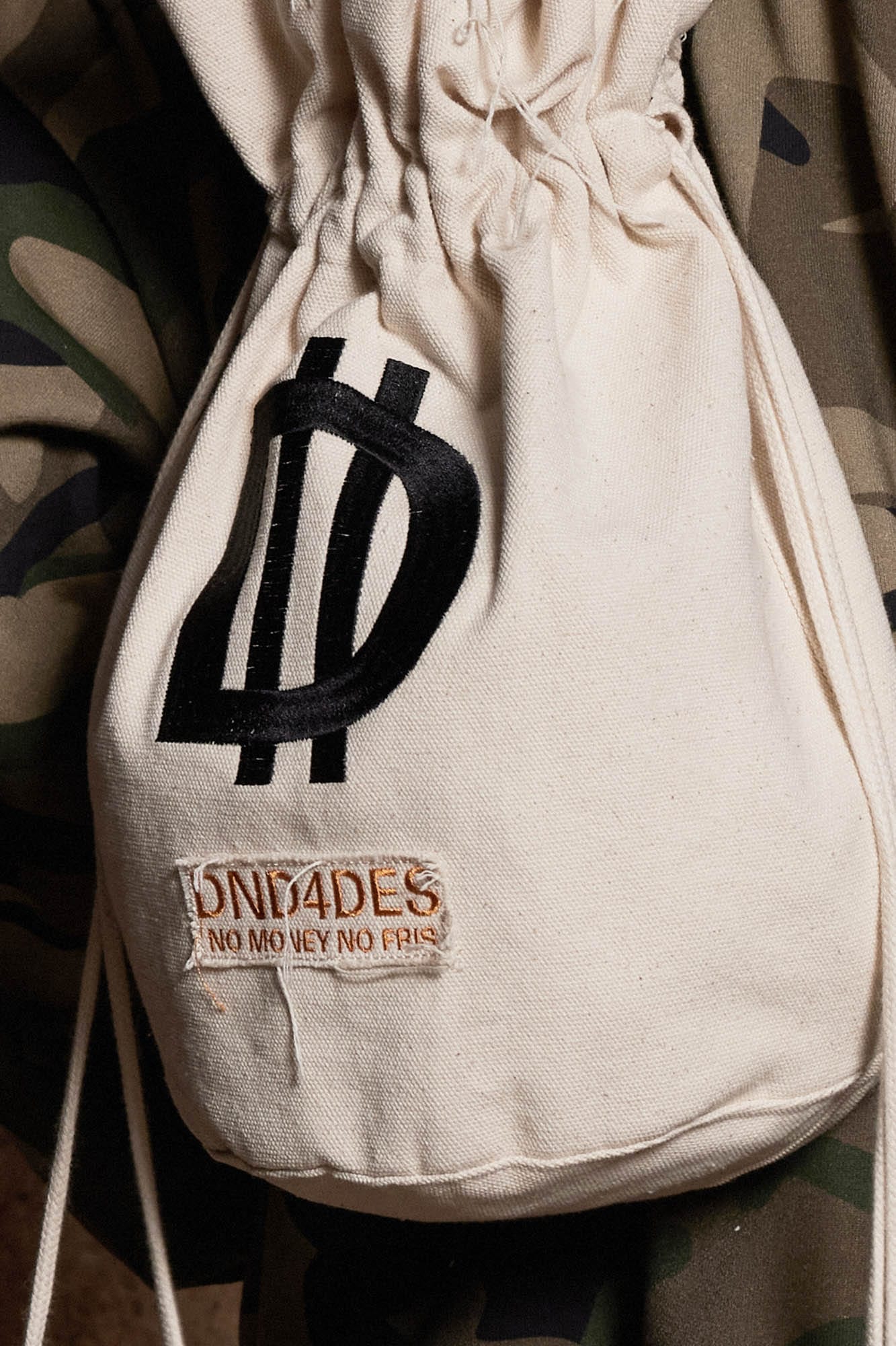 DND4DES LOGO Drawstring Bucket Backpack, premium urban and streetwear designers apparel on PROJECTISR.com, DND4DES