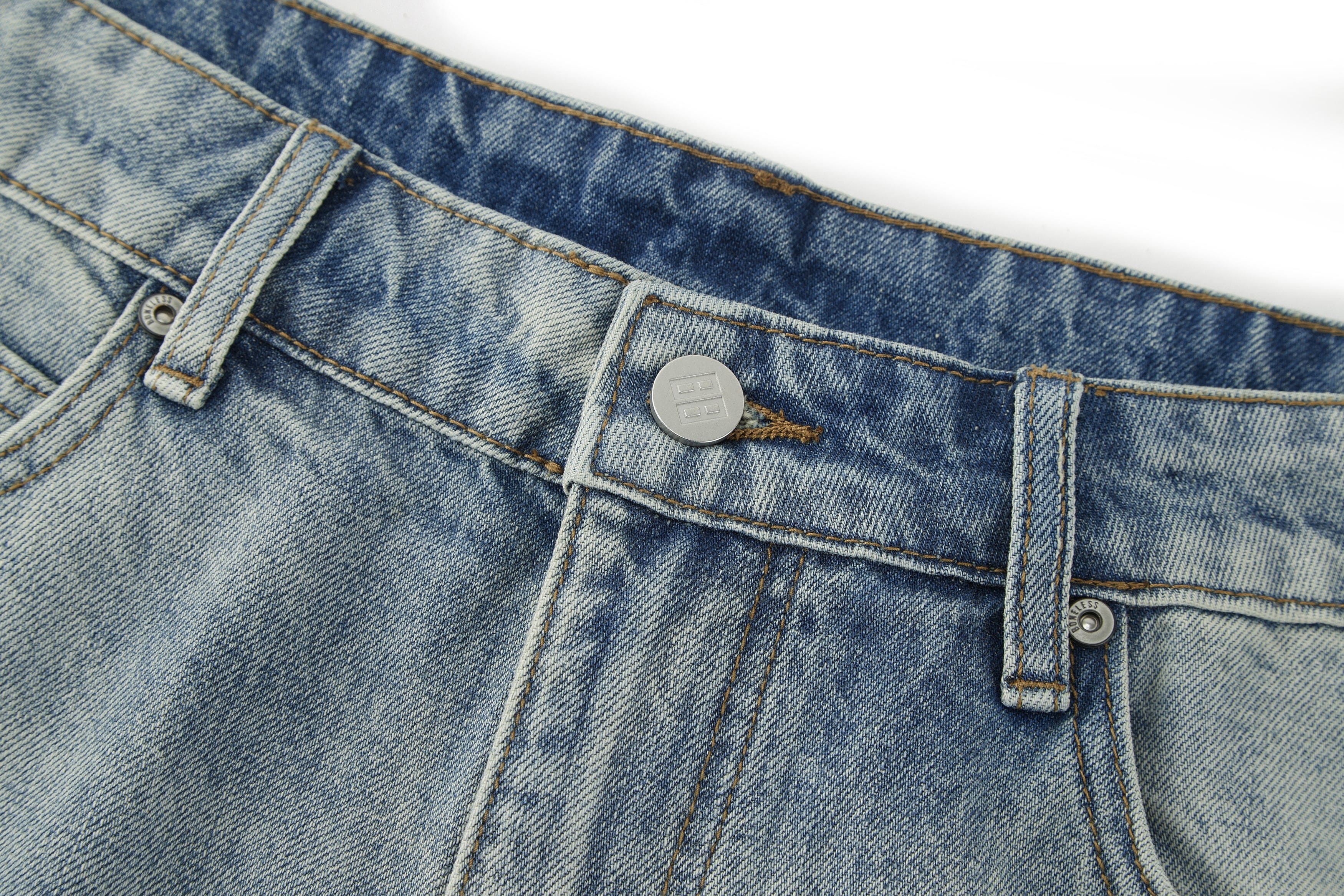 BONELESS Washed Ripped Hem Curved Baggy Jeans