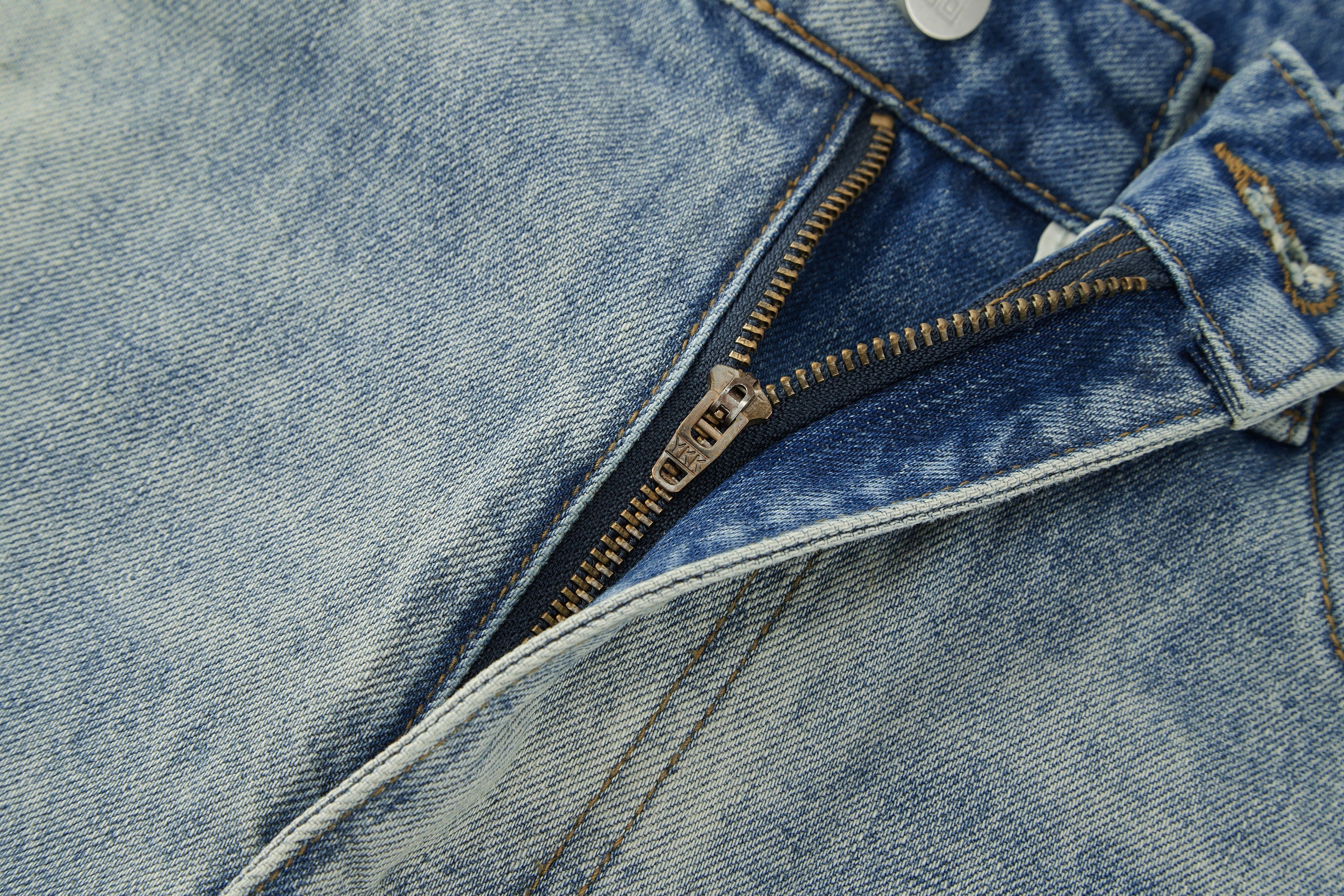 BONELESS Washed Ripped Hem Curved Baggy Jeans