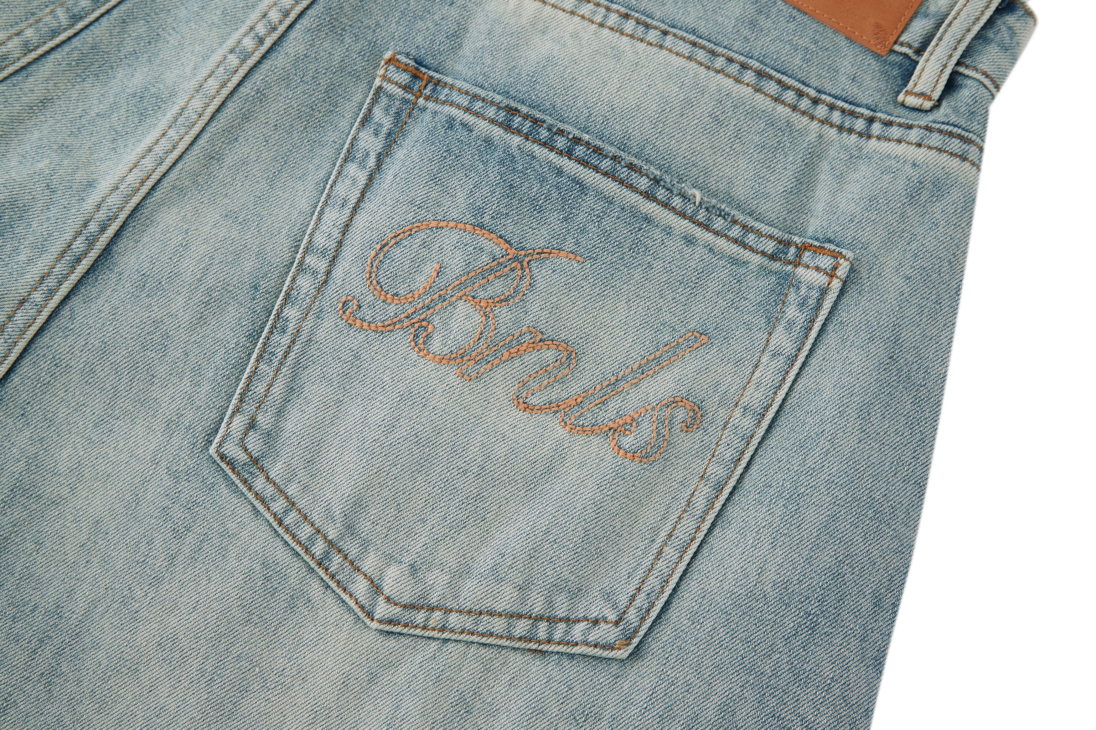BONELESS Washed Ripped Hem Curved Baggy Jeans