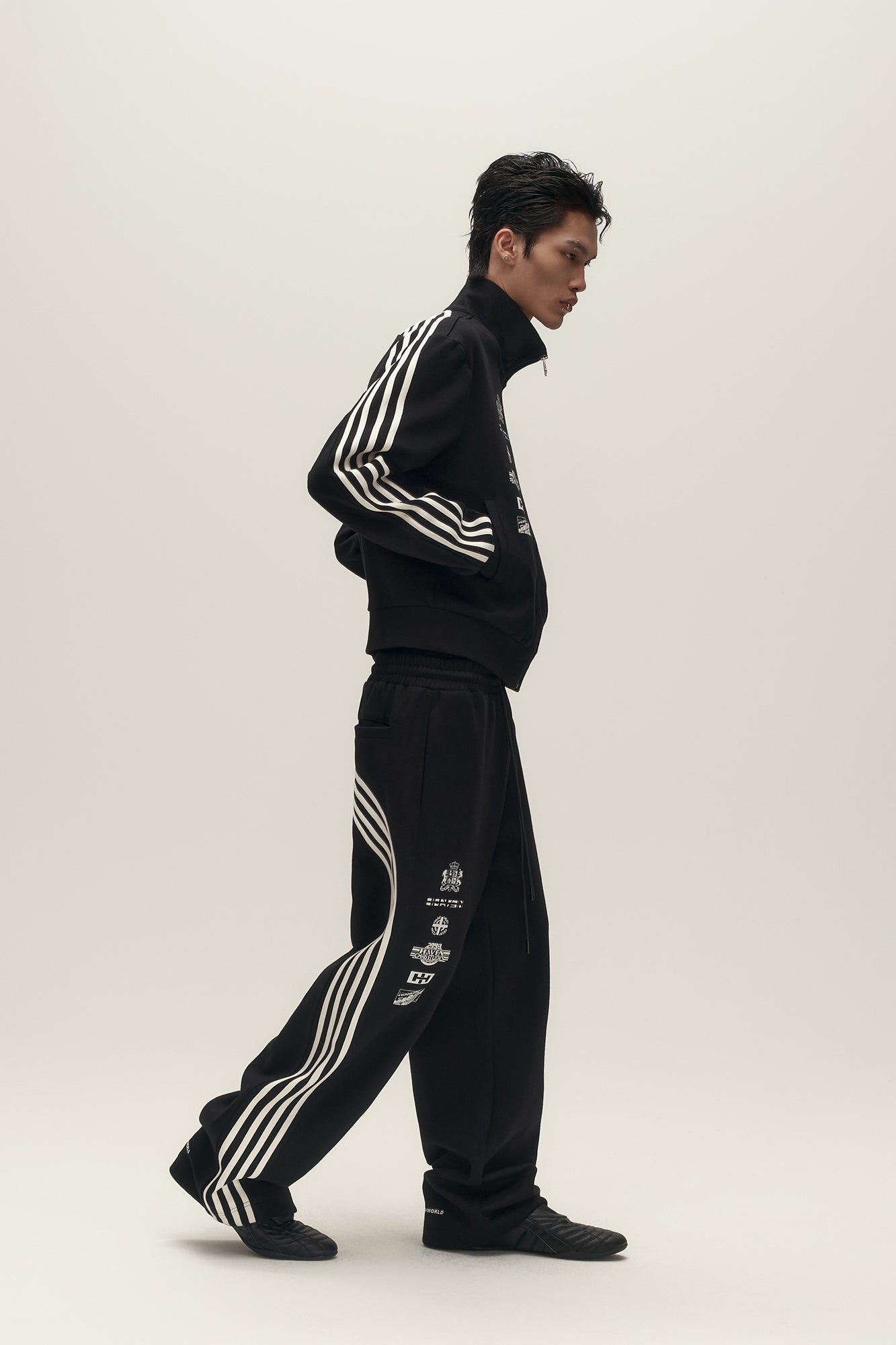SAVAGEGROWTHWORLD Back-Arc Striped Graphic Track Pants, premium urban and streetwear designers apparel on PROJECTISR.com, SAVAGEGROWTHWORLD