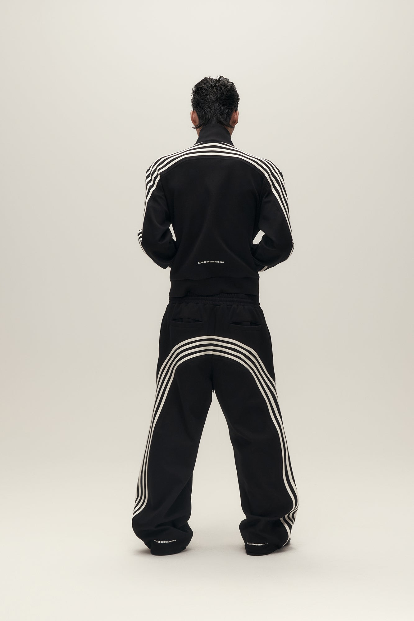 SAVAGEGROWTHWORLD Back-Arc Striped Graphic Track Pants, premium urban and streetwear designers apparel on PROJECTISR.com, SAVAGEGROWTHWORLD