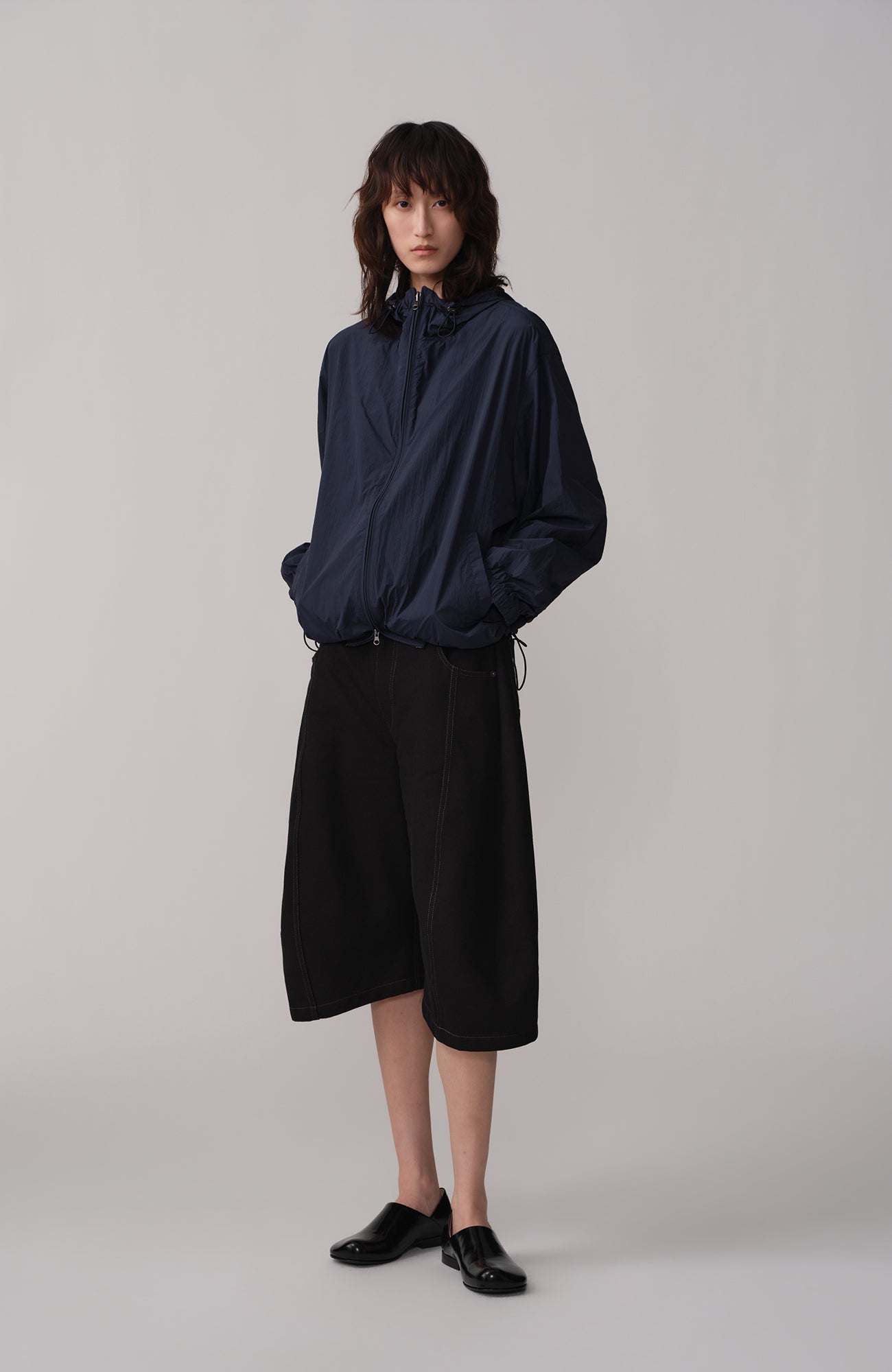 OPICLOTH Curved Wide-Leg Bermuda Shorts