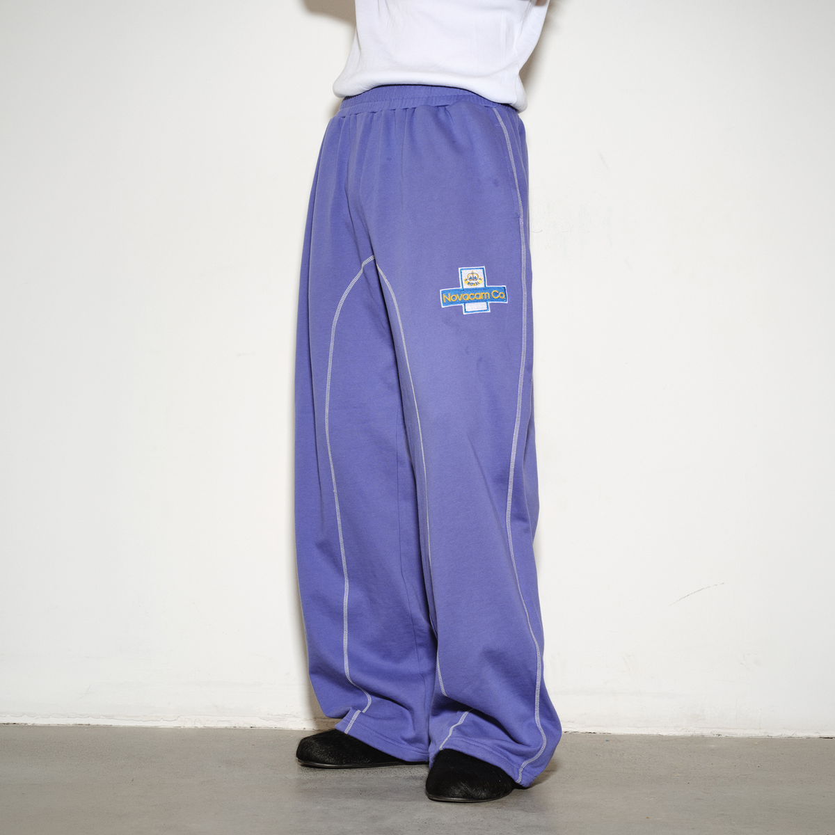 NOVACAM Retro Athletic Embroidered Curved Sweatpants