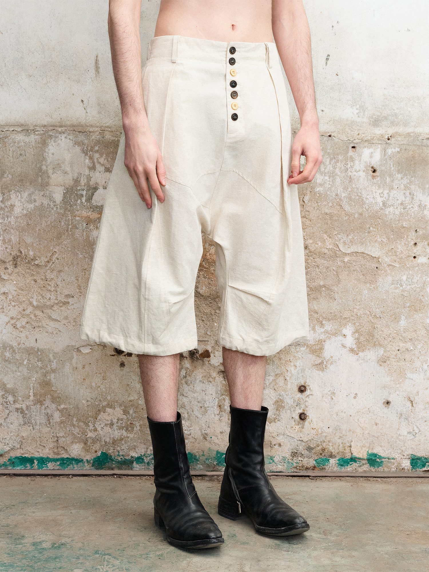 ILNya Nieternite Nifutur Pleated Drop-Crotch Button-Fly Cropped Pants White, premium urban and streetwear designers apparel on PROJECTISR.com, ILNya Nieternite Nifutur