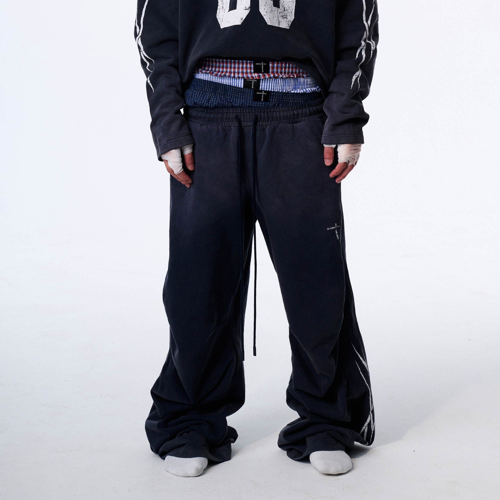 SAVAGEGROWTHWORLD Distressed Pleated Drawstring Baggy Pants, premium urban and streetwear designers apparel on PROJECTISR.com, SAVAGEGROWTHWORLD