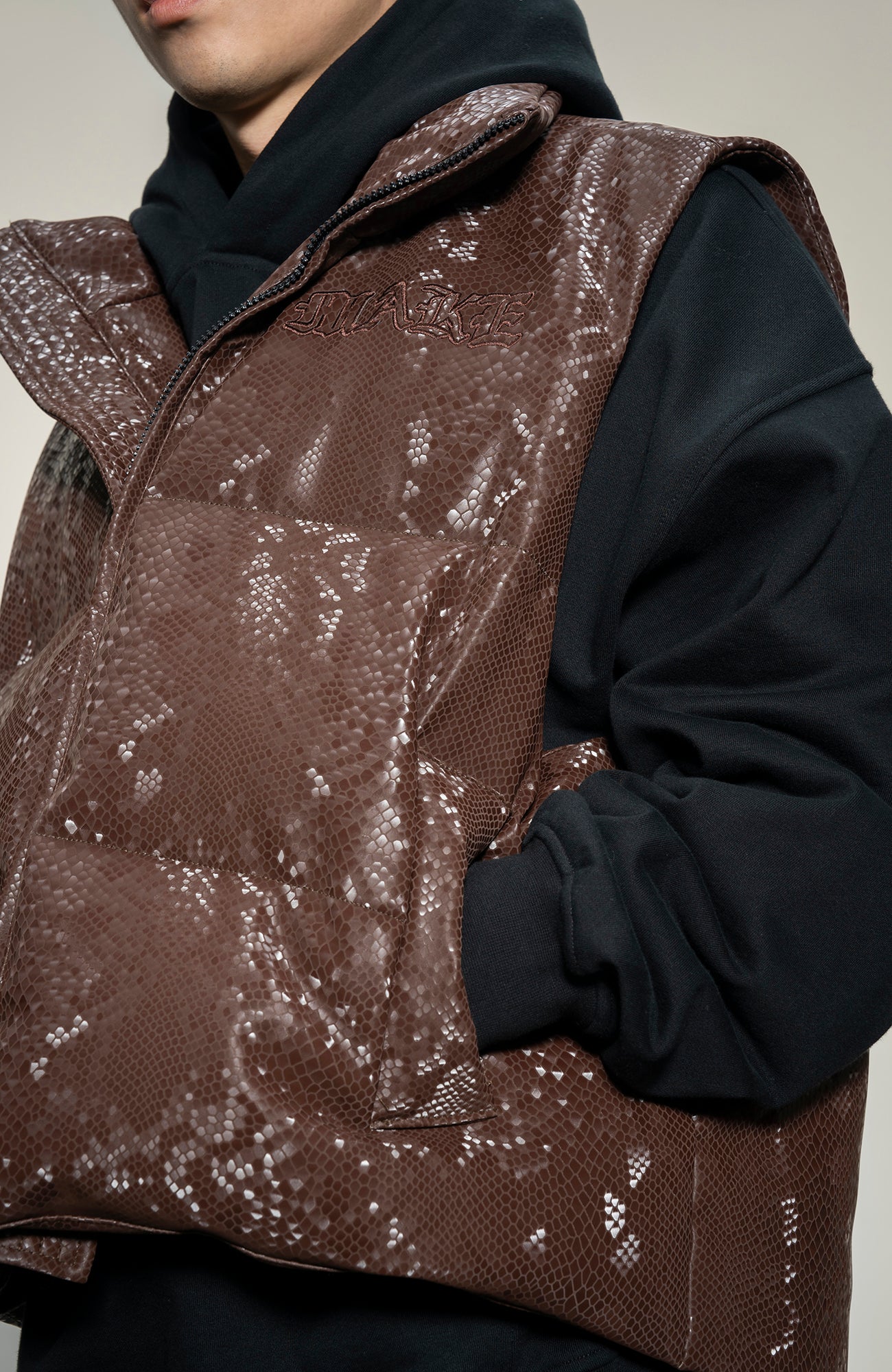 MAKEMORE Scale-Textured PU Embroidered Puffer Vest