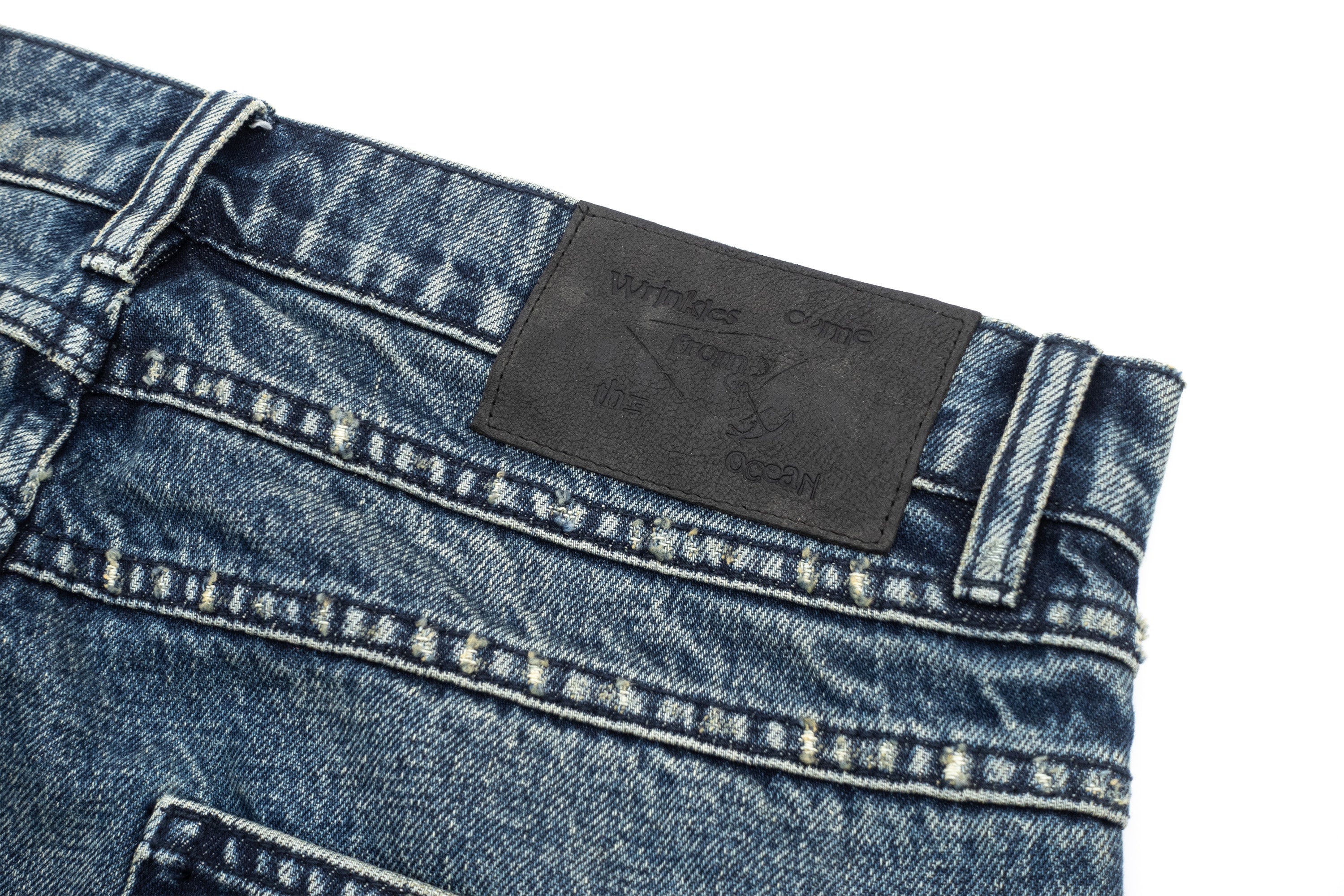 IN EXISTENCE Distressed Stitched Patch Flared Jeans