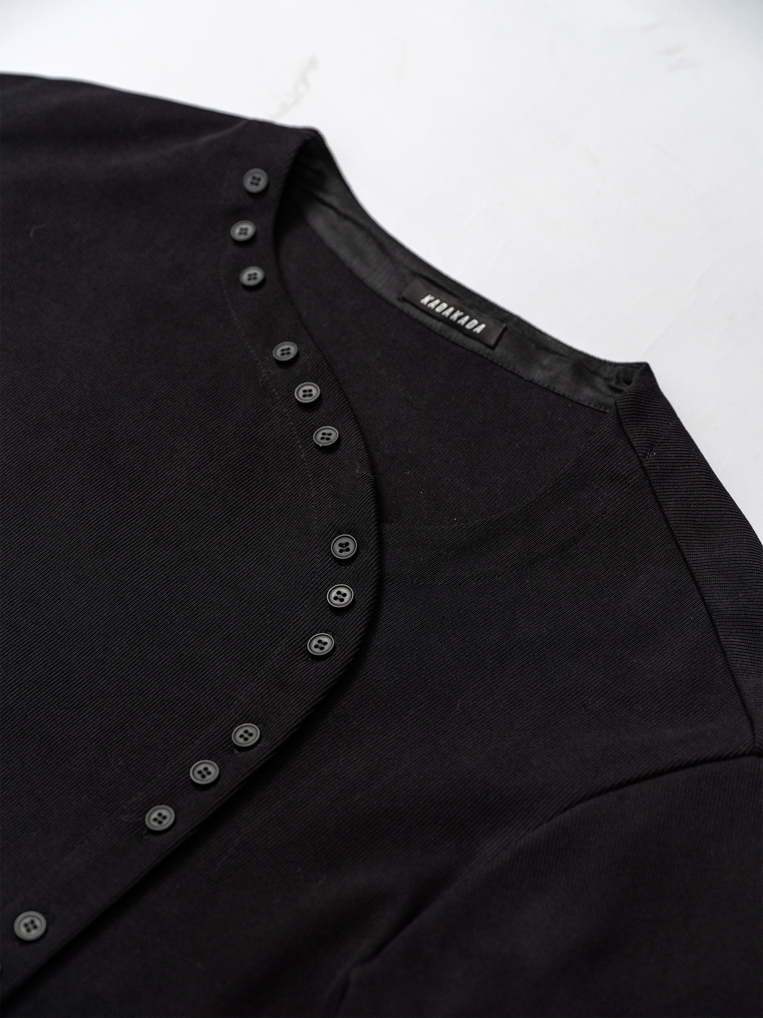 KADAKADA Buttoned Curved Placket Ribbed Knit Top