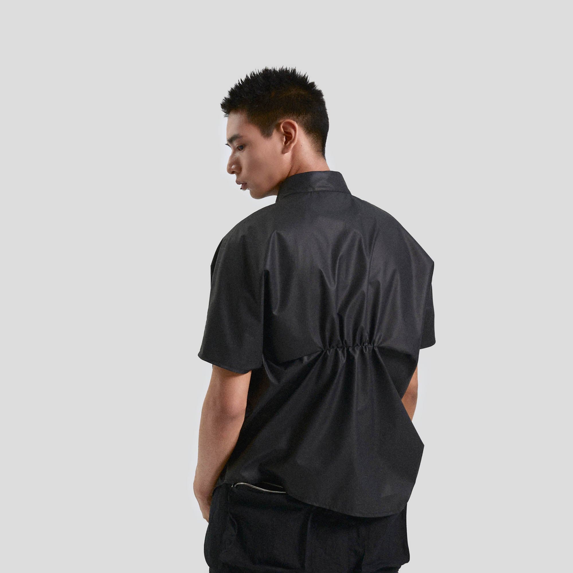 KADAKADA Asymmetrical Pleated Faux Leather Half Shirt, premium urban and streetwear designers apparel on PROJECTISR.com, KADAKADA