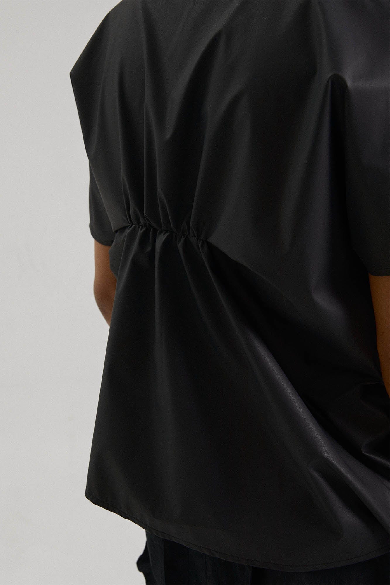 KADAKADA Asymmetrical Pleated Faux Leather Half Shirt, premium urban and streetwear designers apparel on PROJECTISR.com, KADAKADA