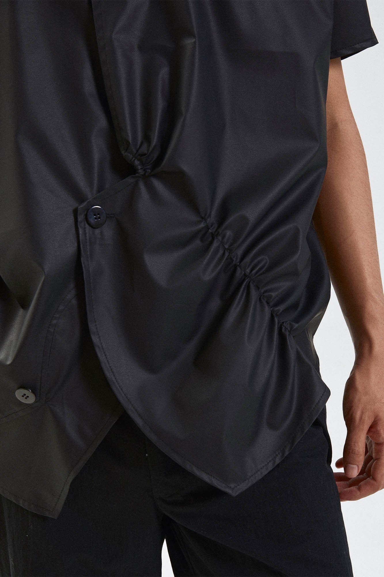 KADAKADA Asymmetrical Pleated Faux Leather Half Shirt, premium urban and streetwear designers apparel on PROJECTISR.com, KADAKADA