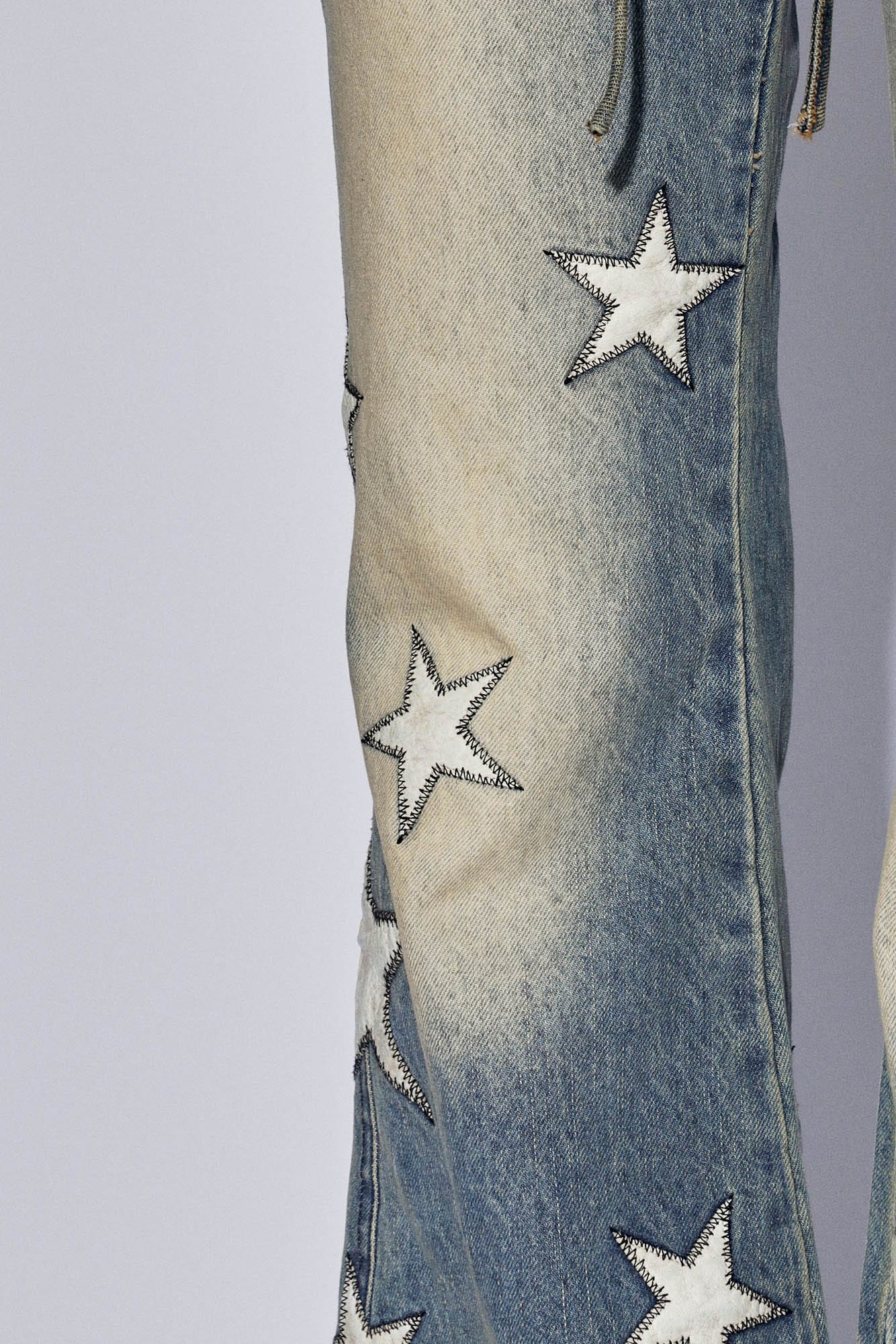 DND4DESxFaychui Starry Bleached Low-Rise Flared Jeans