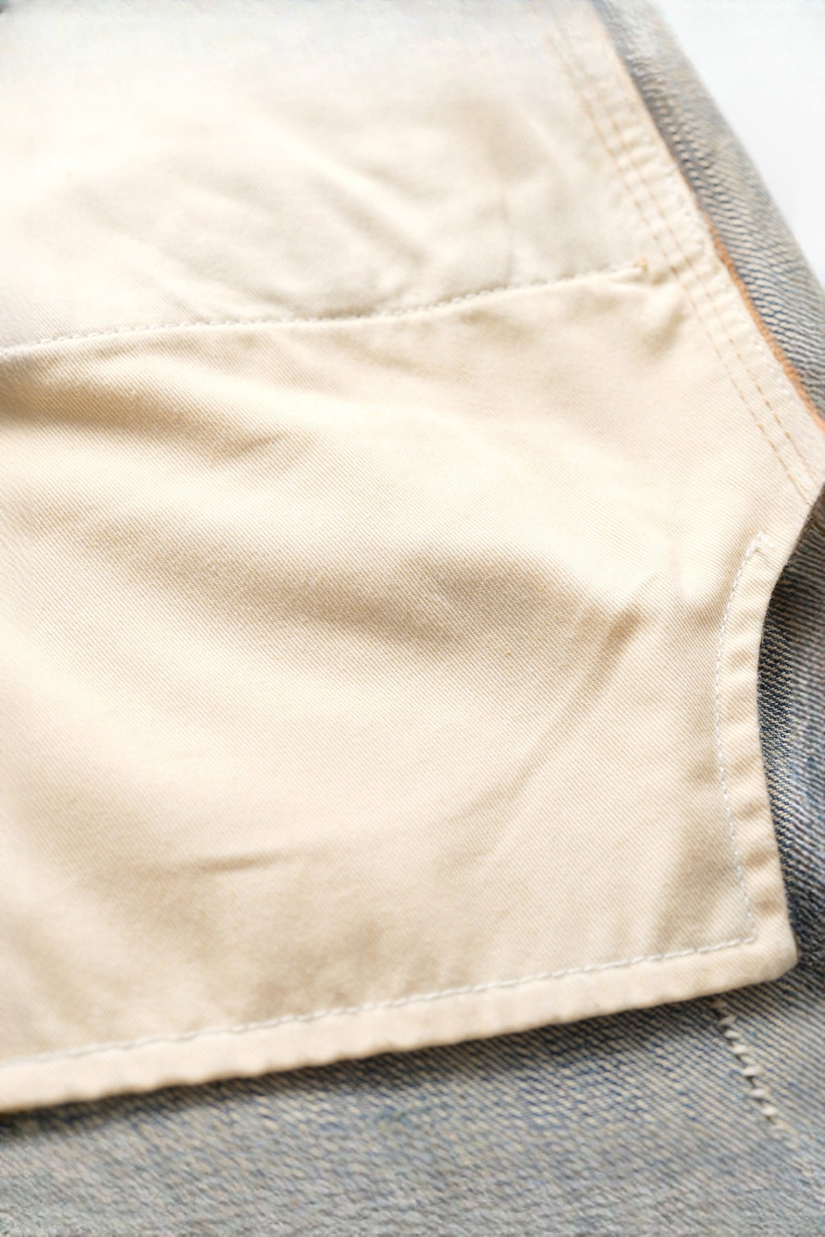 NEIGBORL Distressed Raw-Edge Selvedge Jeans — flat-lay detail
