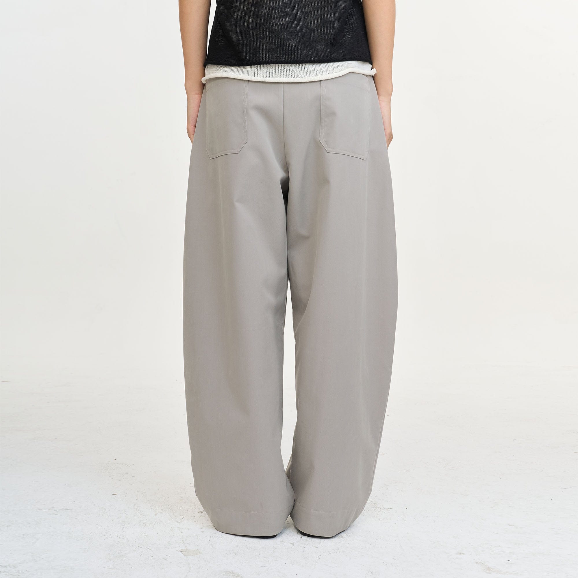 LEONSENSE Pleated Tencel Oversized Curved Pants, premium urban and streetwear designers apparel on PROJECTISR.com, LEONSENSE