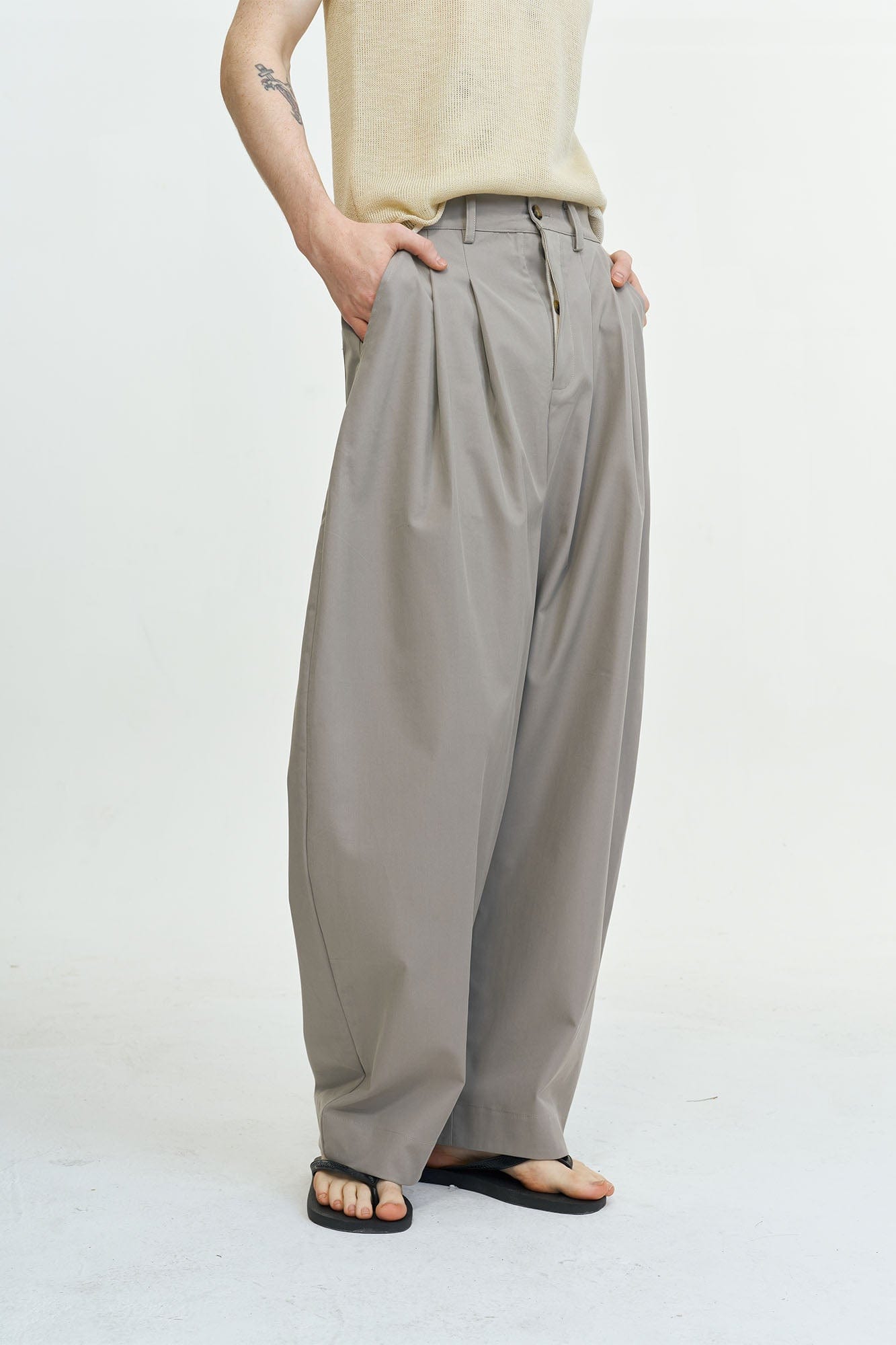 LEONSENSE Pleated Tencel Oversized Curved Pants, premium urban and streetwear designers apparel on PROJECTISR.com, LEONSENSE