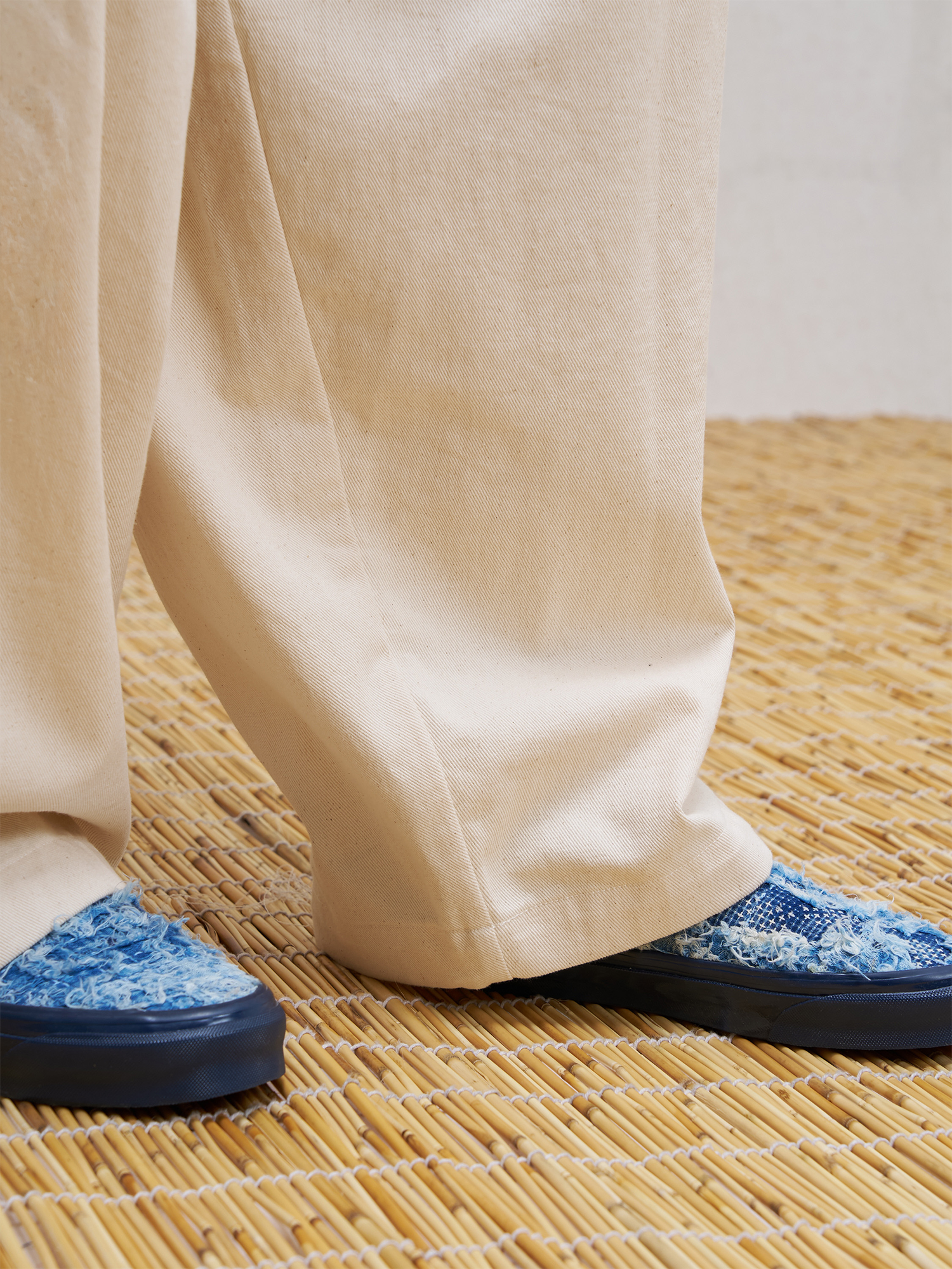 UNLIMITED MOTE Pleated Herringbone Wide-Leg Trousers