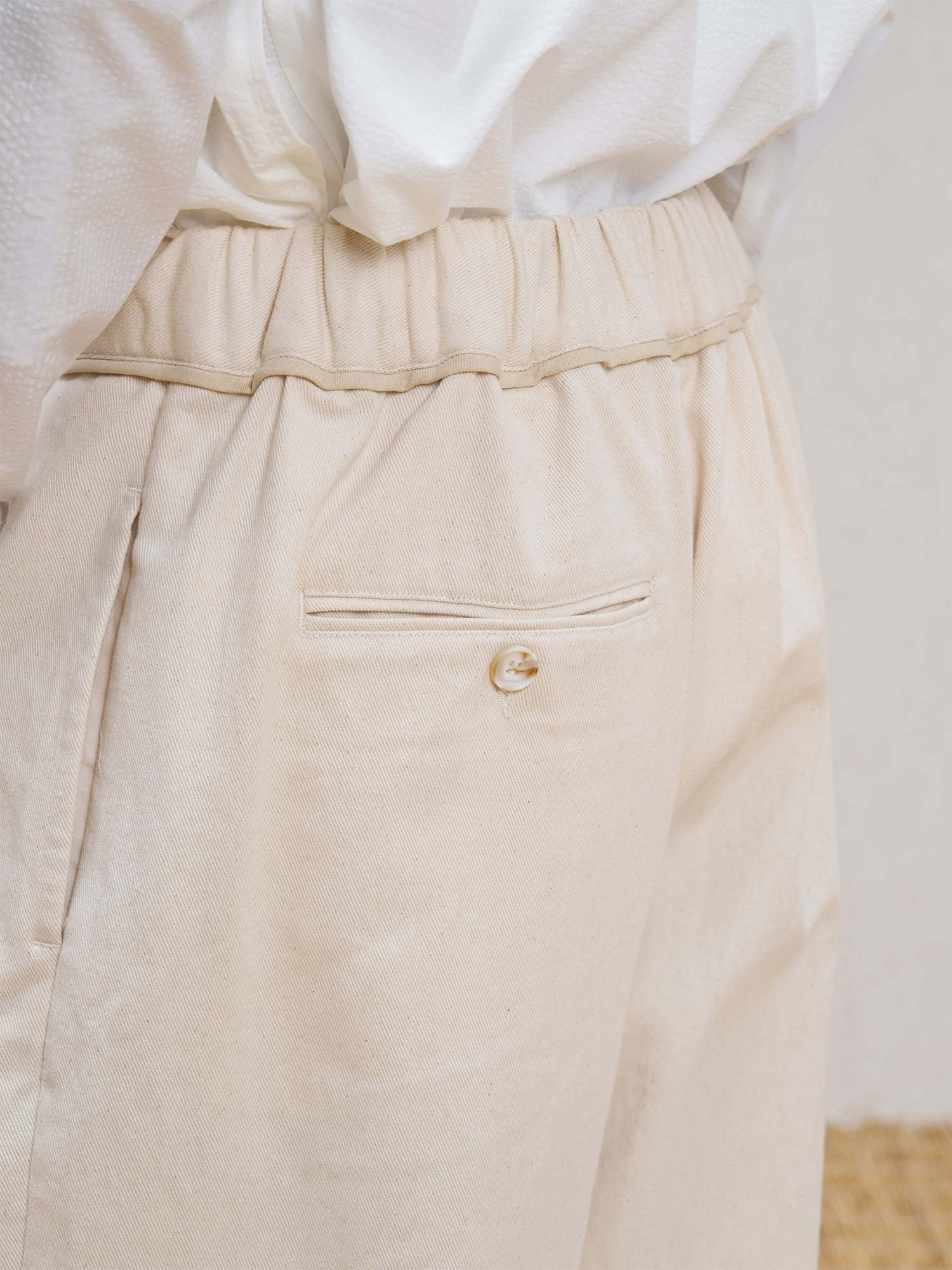 UNLIMITED MOTE Pleated Herringbone Wide-Leg Trousers