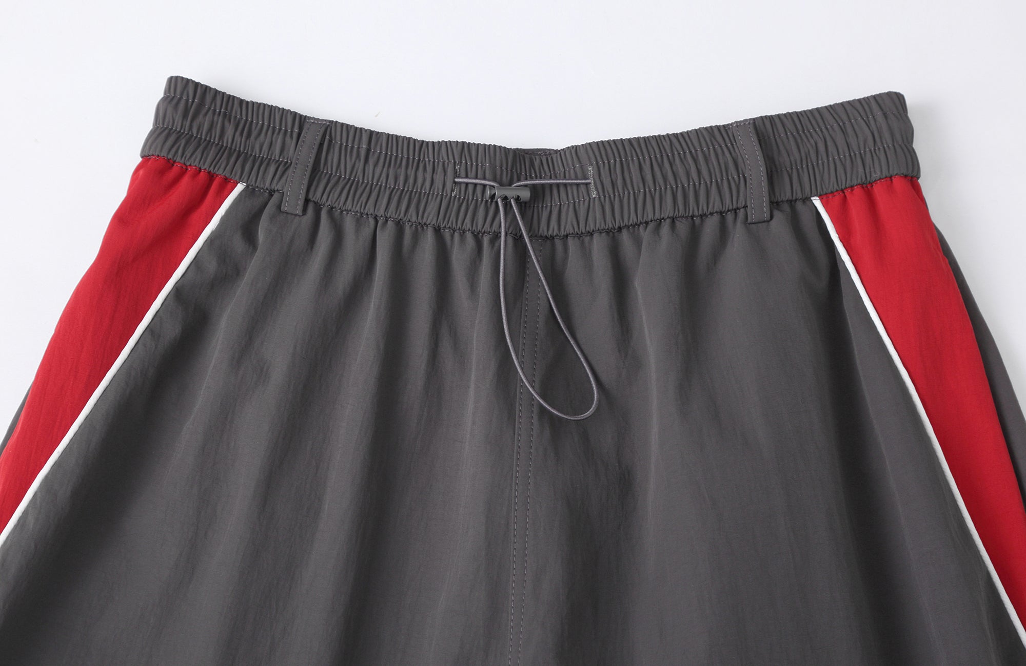 CLP Contrast Panel Pleated-Knee Drawstring-Hem Pants