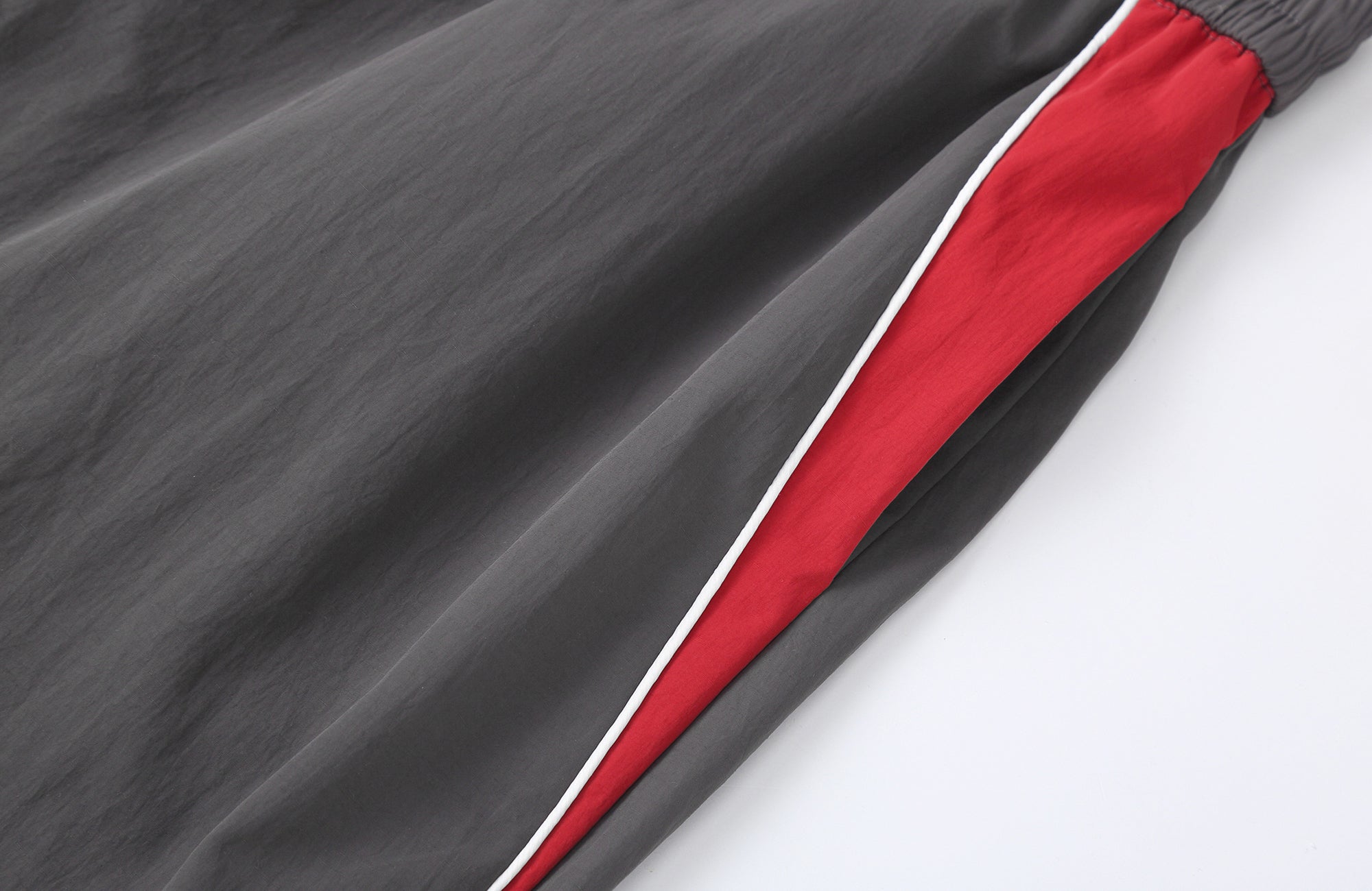 CLP Contrast Panel Pleated-Knee Drawstring-Hem Pants