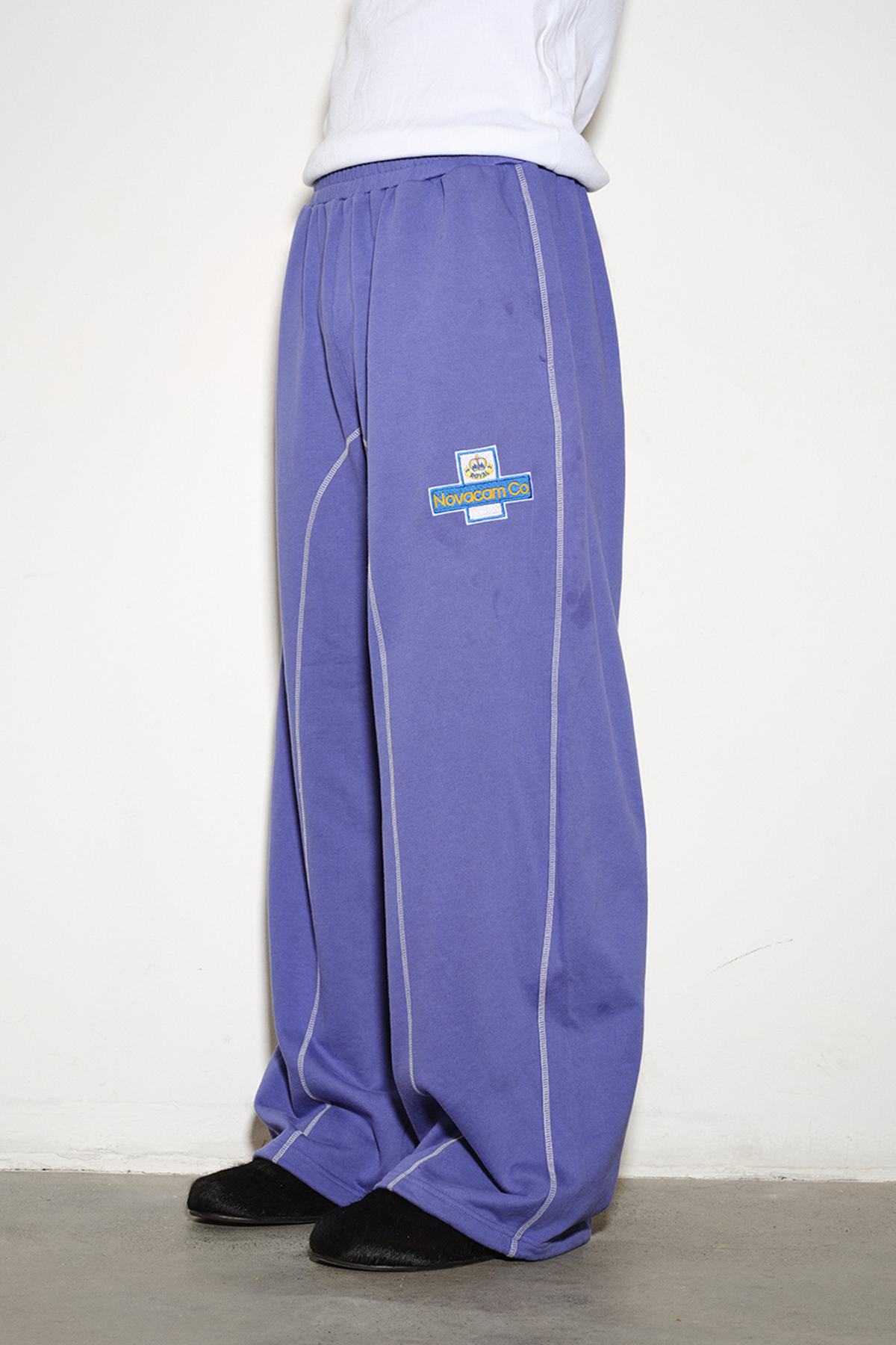 NOVACAM Retro Athletic Embroidered Curved Sweatpants