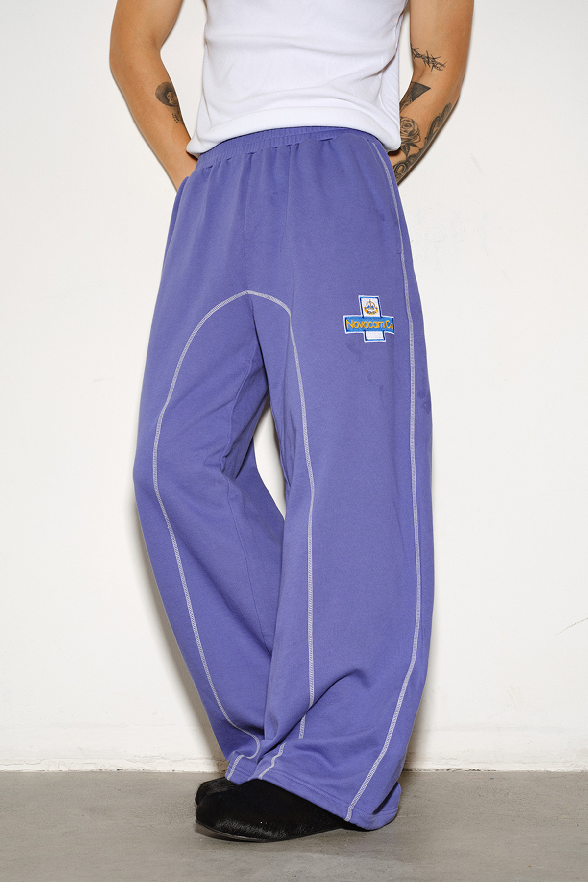 NOVACAM Retro Athletic Embroidered Curved Sweatpants