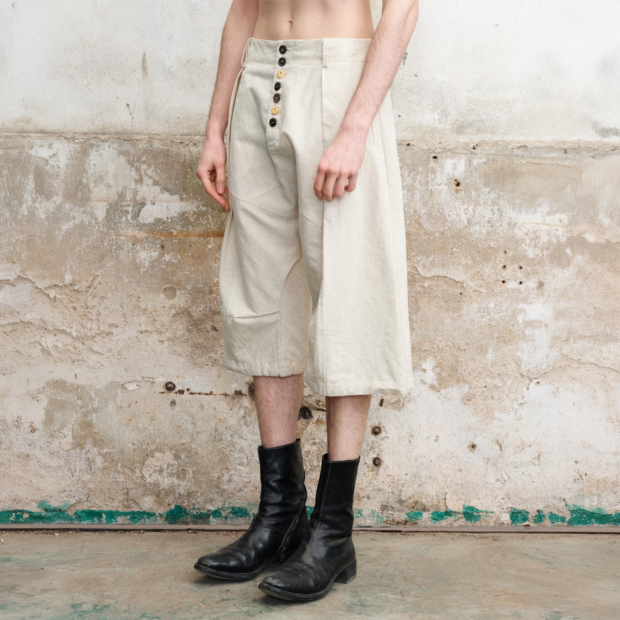 ILNya Nieternite Nifutur Pleated Drop-Crotch Button-Fly Cropped Pants White, premium urban and streetwear designers apparel on PROJECTISR.com, ILNya Nieternite Nifutur