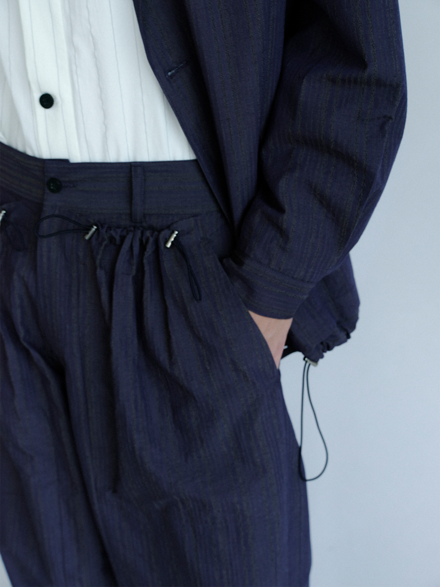 GRAINMUSTARD Drawstring Pleated Straight-Leg Trousers, premium urban and streetwear designers apparel on PROJECTISR.com, GRAINMUSTARD