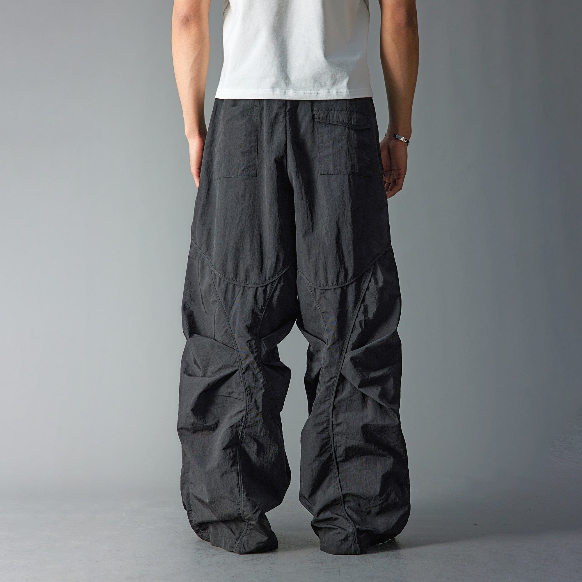 WHISTLEHUNTER Deconstructed Pleated Zipper Pockets Pants