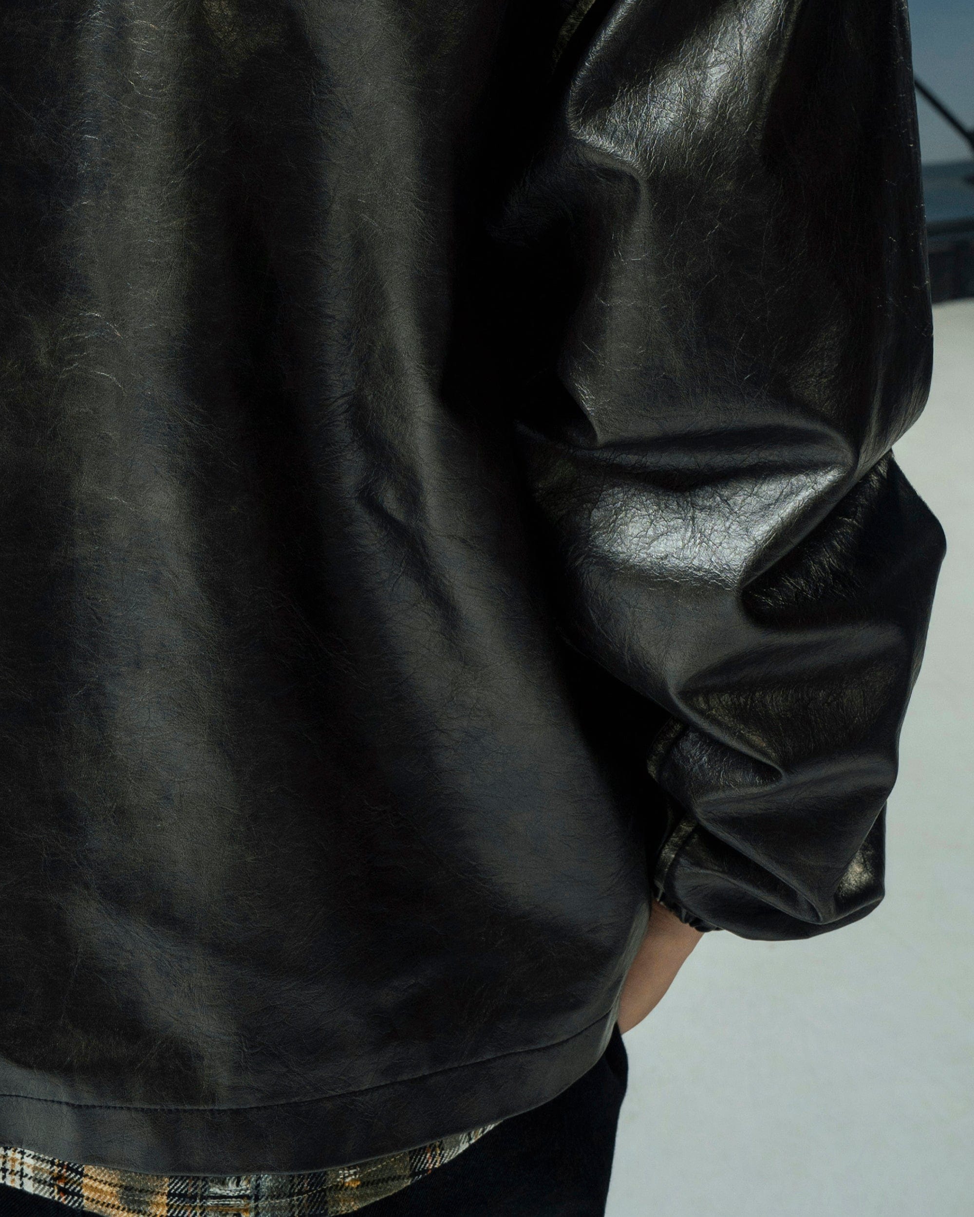 MAKEMORE Classic Faux Leather Embossed Coach Jacket