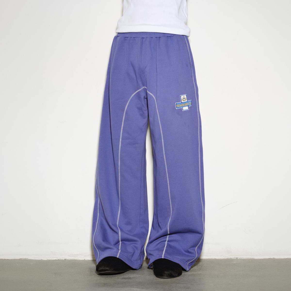 NOVACAM Retro Athletic Embroidered Curved Sweatpants
