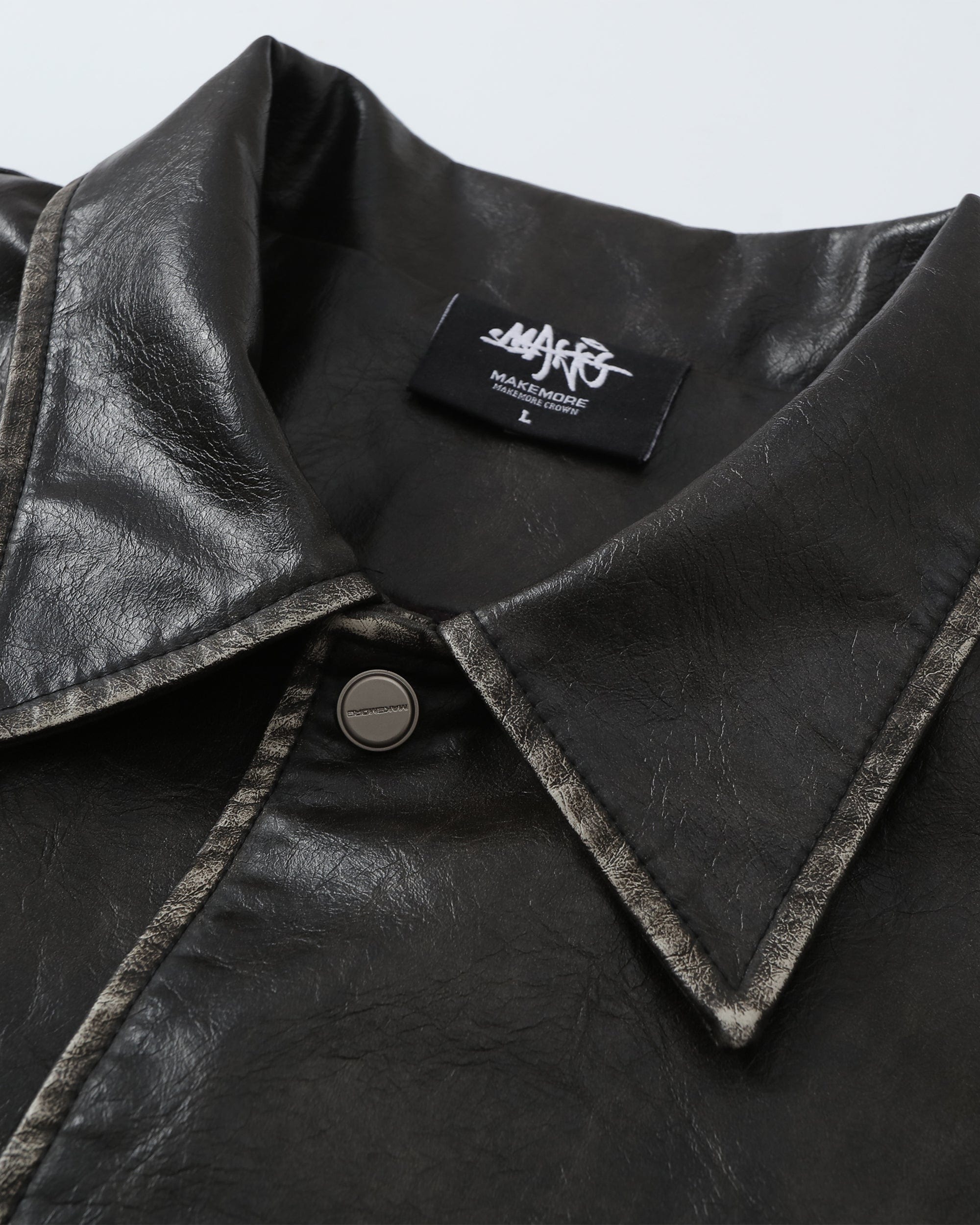 MAKEMORE Classic Faux Leather Embossed Coach Jacket