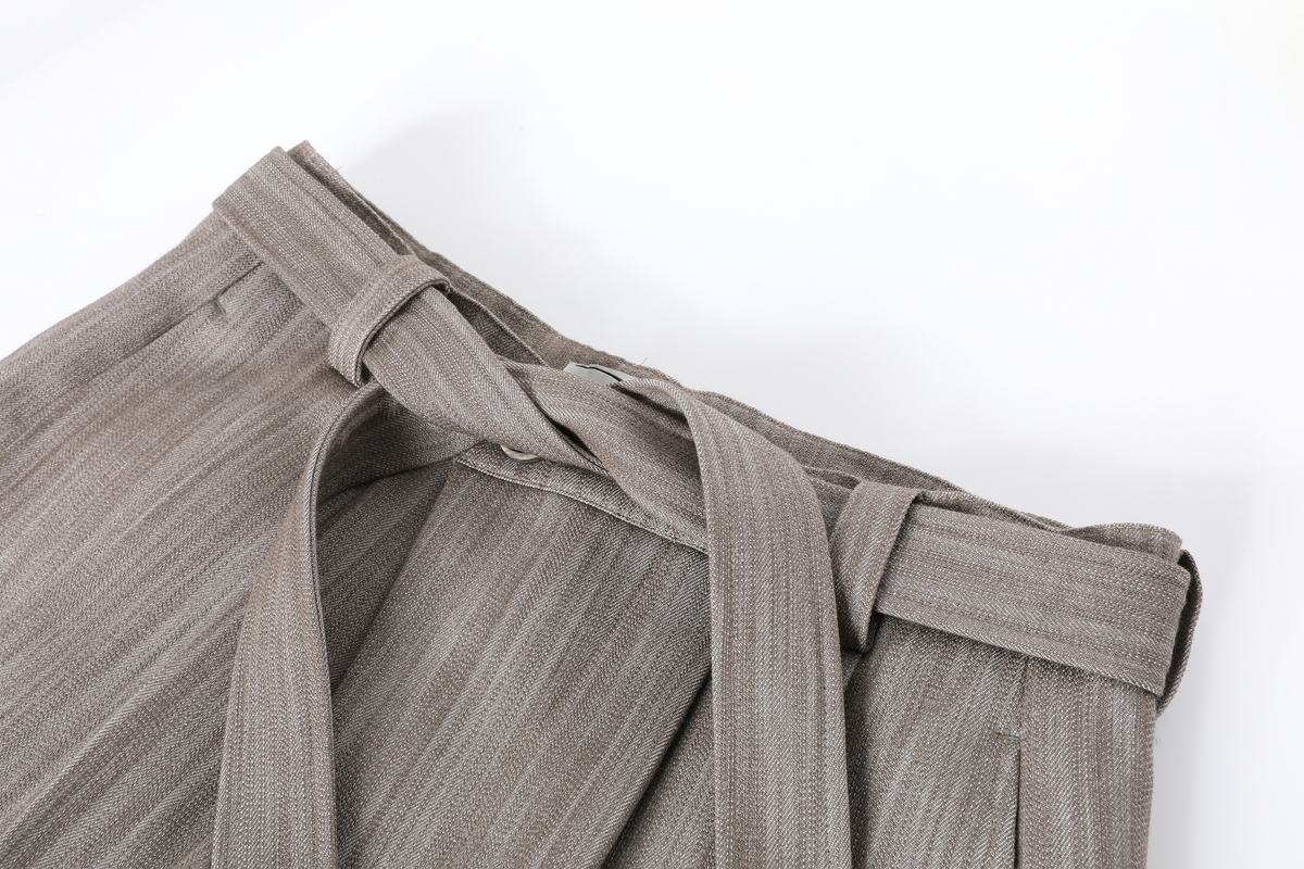 REMODUTION Asymmetrical Pleated Wide-Leg Trousers