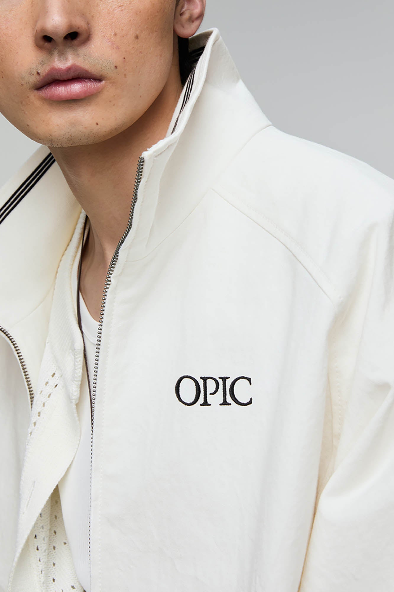 OPICLOTH Embroidered Logo Stand Collar Raglan Jacket