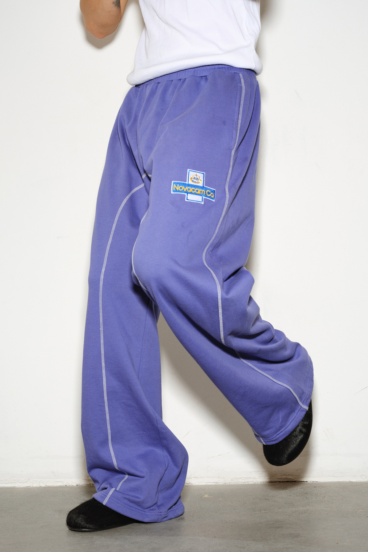 NOVACAM Retro Athletic Embroidered Curved Sweatpants