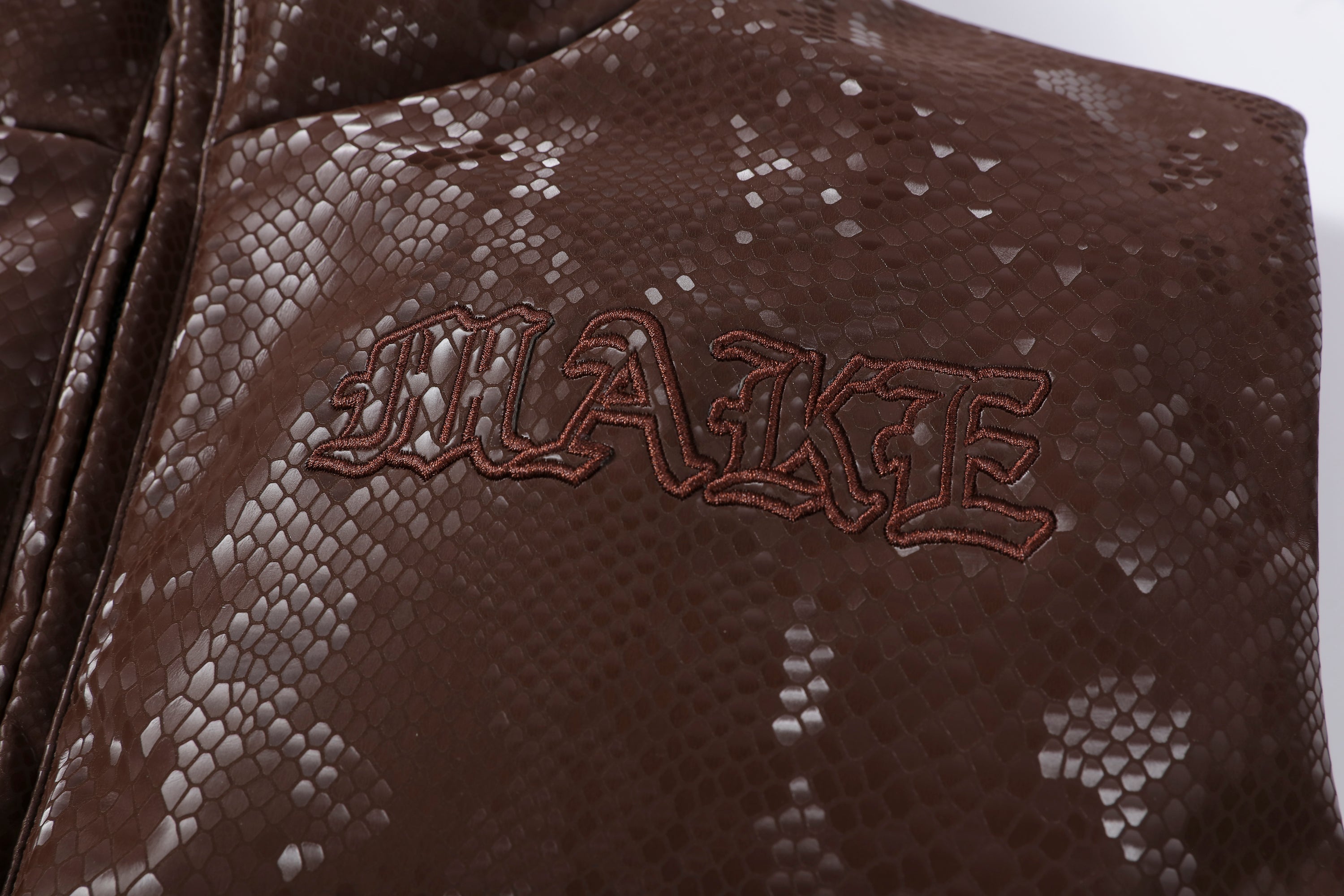 MAKEMORE Scale-Textured PU Embroidered Puffer Vest