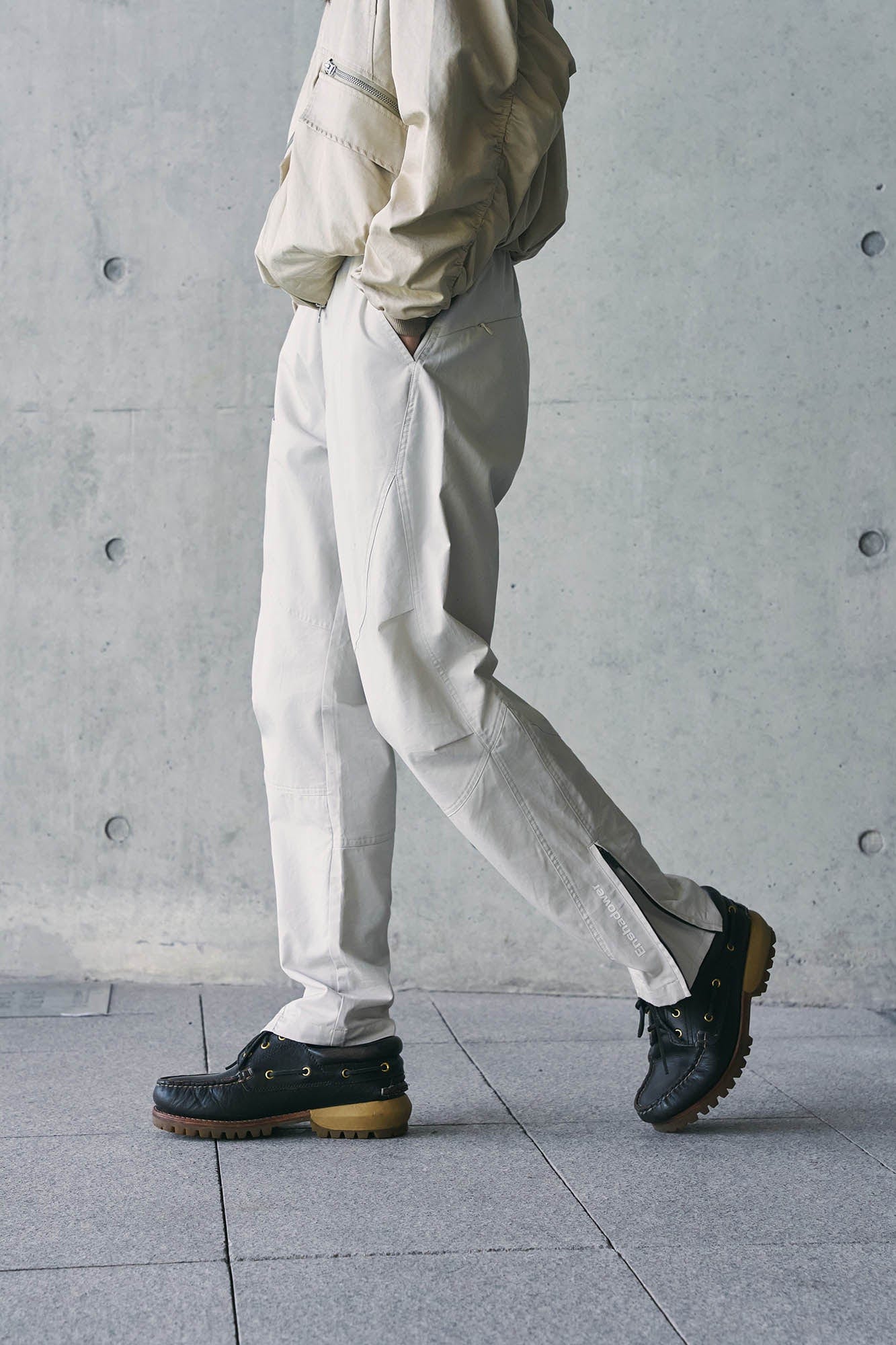 ENSHADOWER Spliced Crinkled Zippered Jogger Pants White