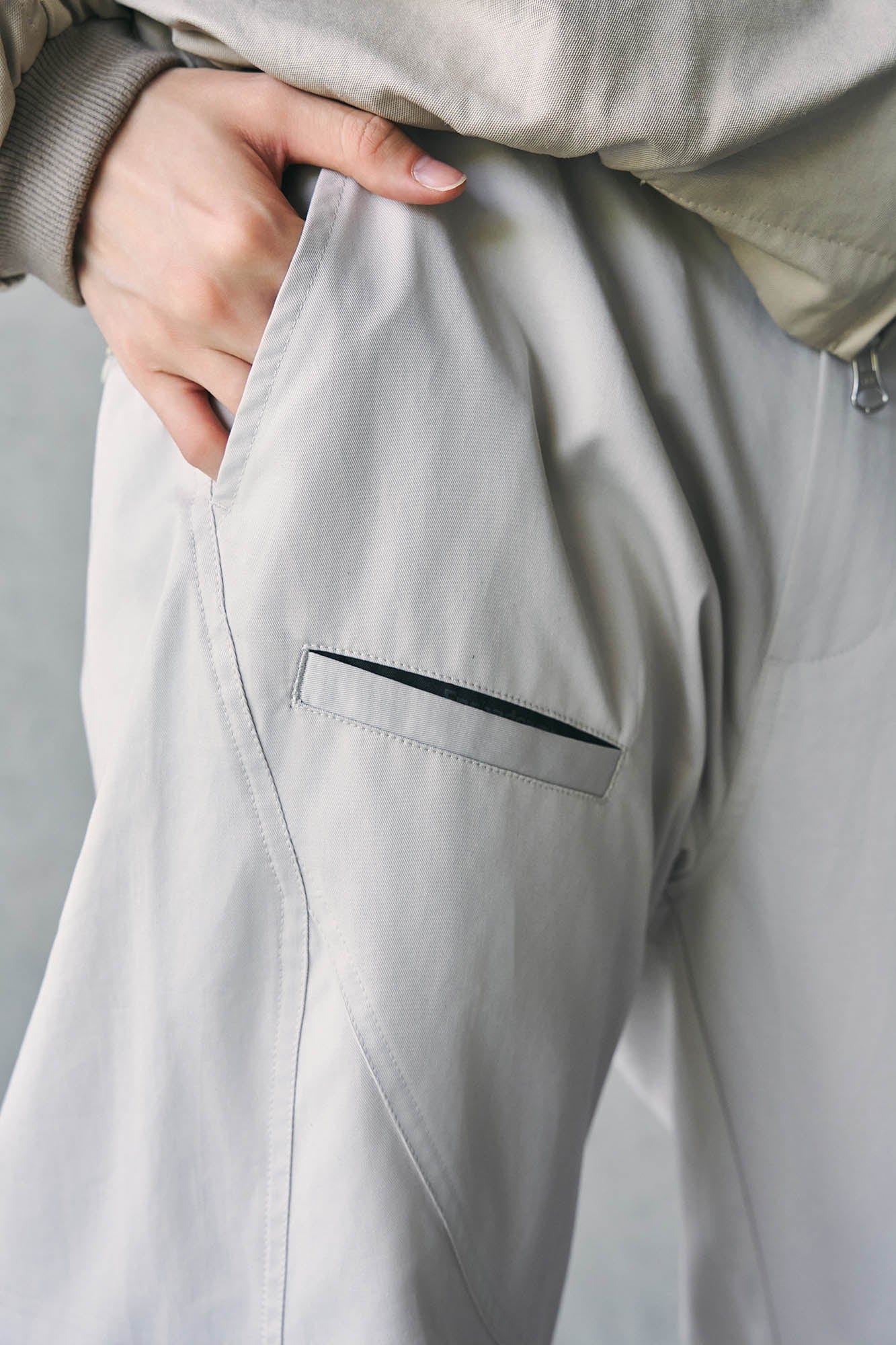 ENSHADOWER Spliced Crinkled Zippered Jogger Pants White