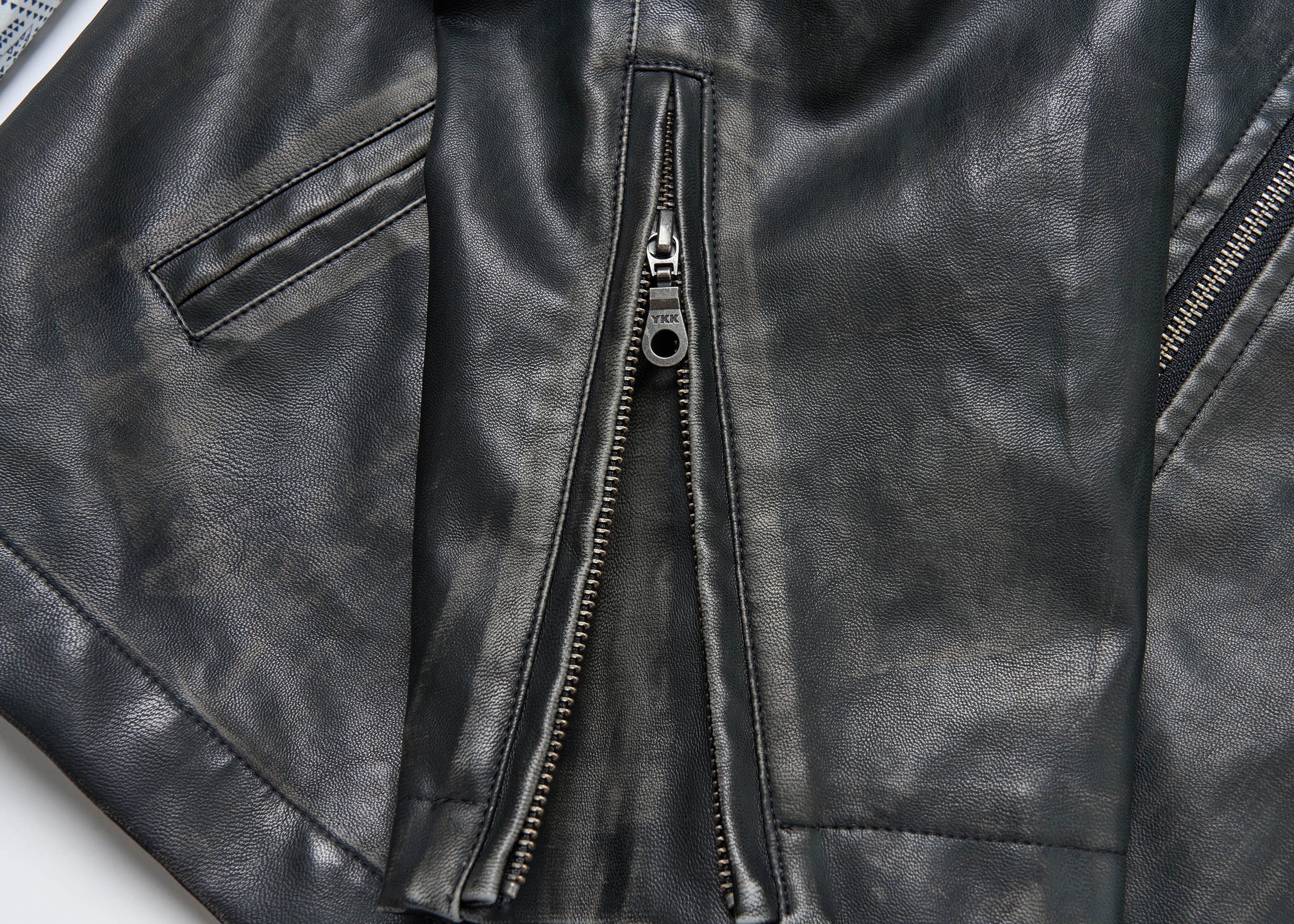 SAVAGEGROWTHWORLD Crossed Spliced Rivet Faux Leather Jacket