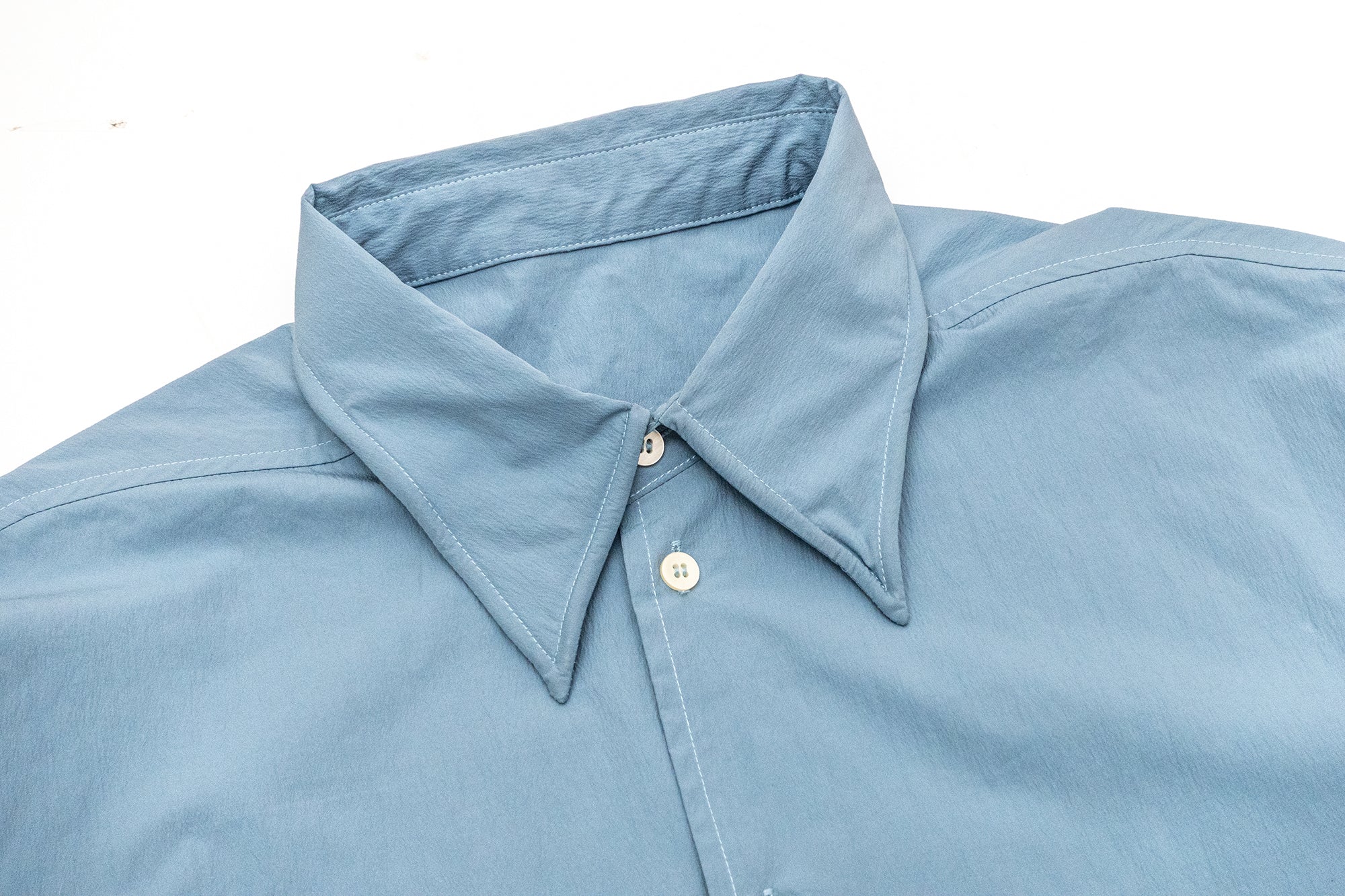 IN EXISTENCE Wired Formable Edge Layered Hem Shirt