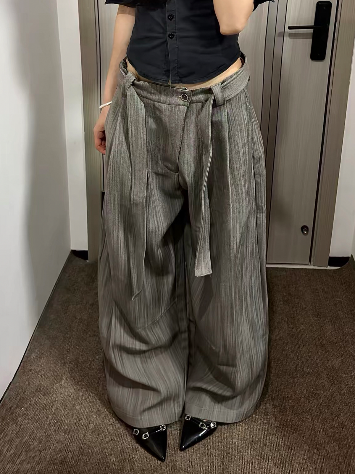 REMODUTION Asymmetrical Pleated Wide-Leg Trousers